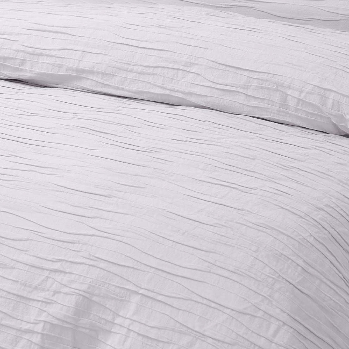 Malvern White Cotton Quilt Cover Set featuring horizontal pleats, perfect for a chic bedroom decor.