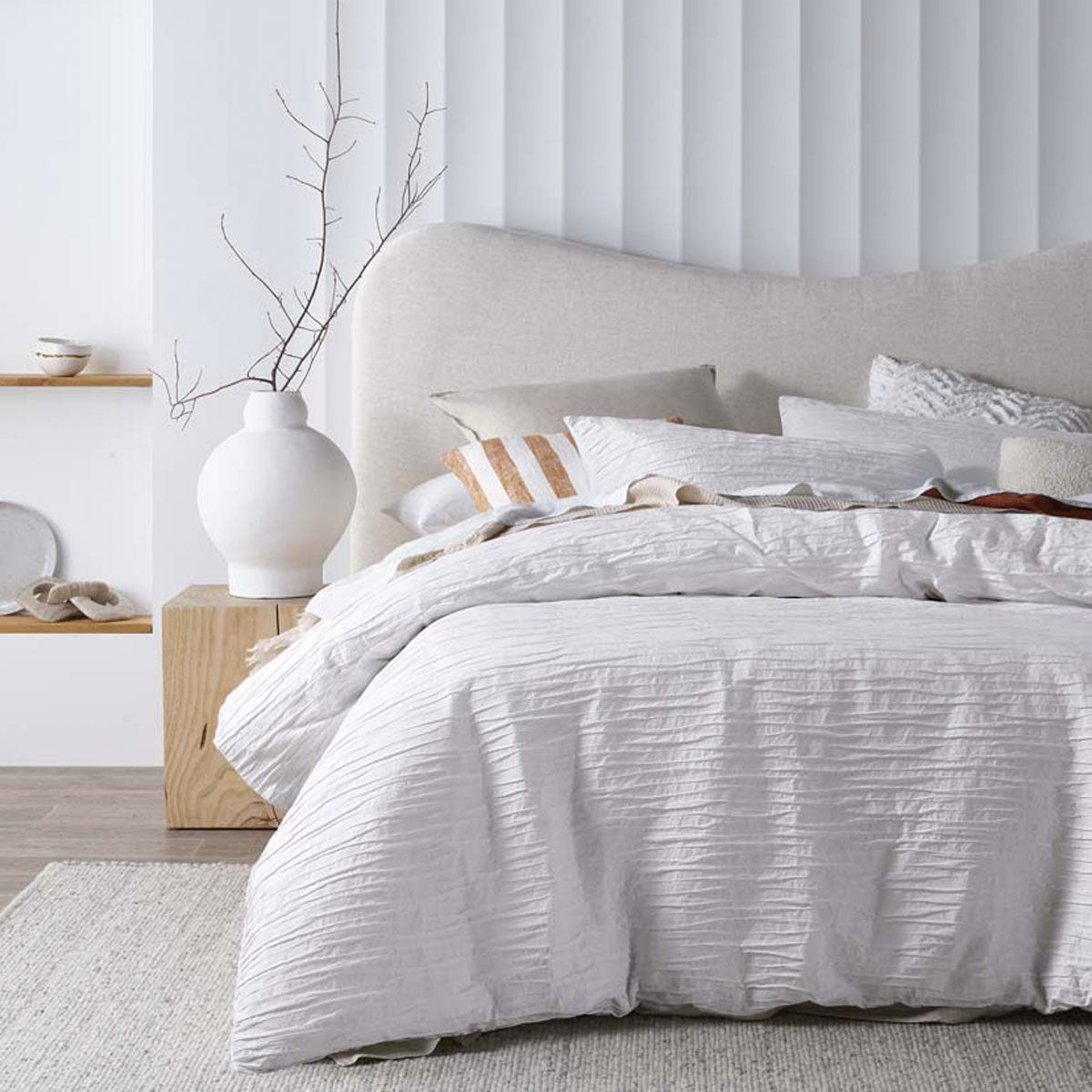 Malvern White Cotton Quilt Cover Set featuring horizontal pleats, perfect for a chic bedroom decor.