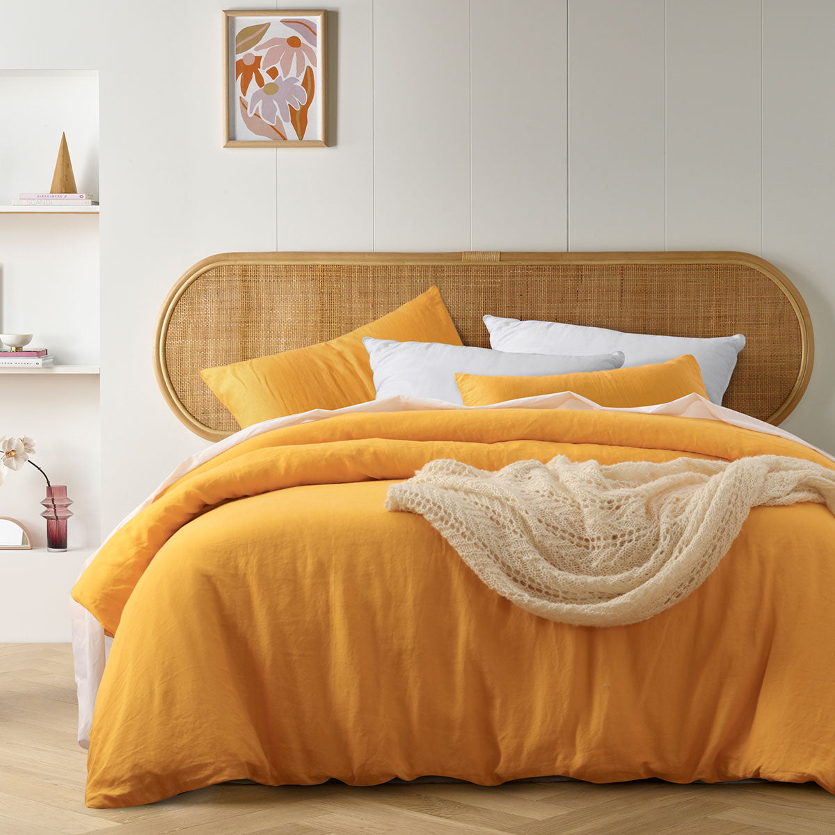 Marigold French Linen Quilt Cover Set displayed on a queen-sized bed, showcasing its soft texture and warm color.