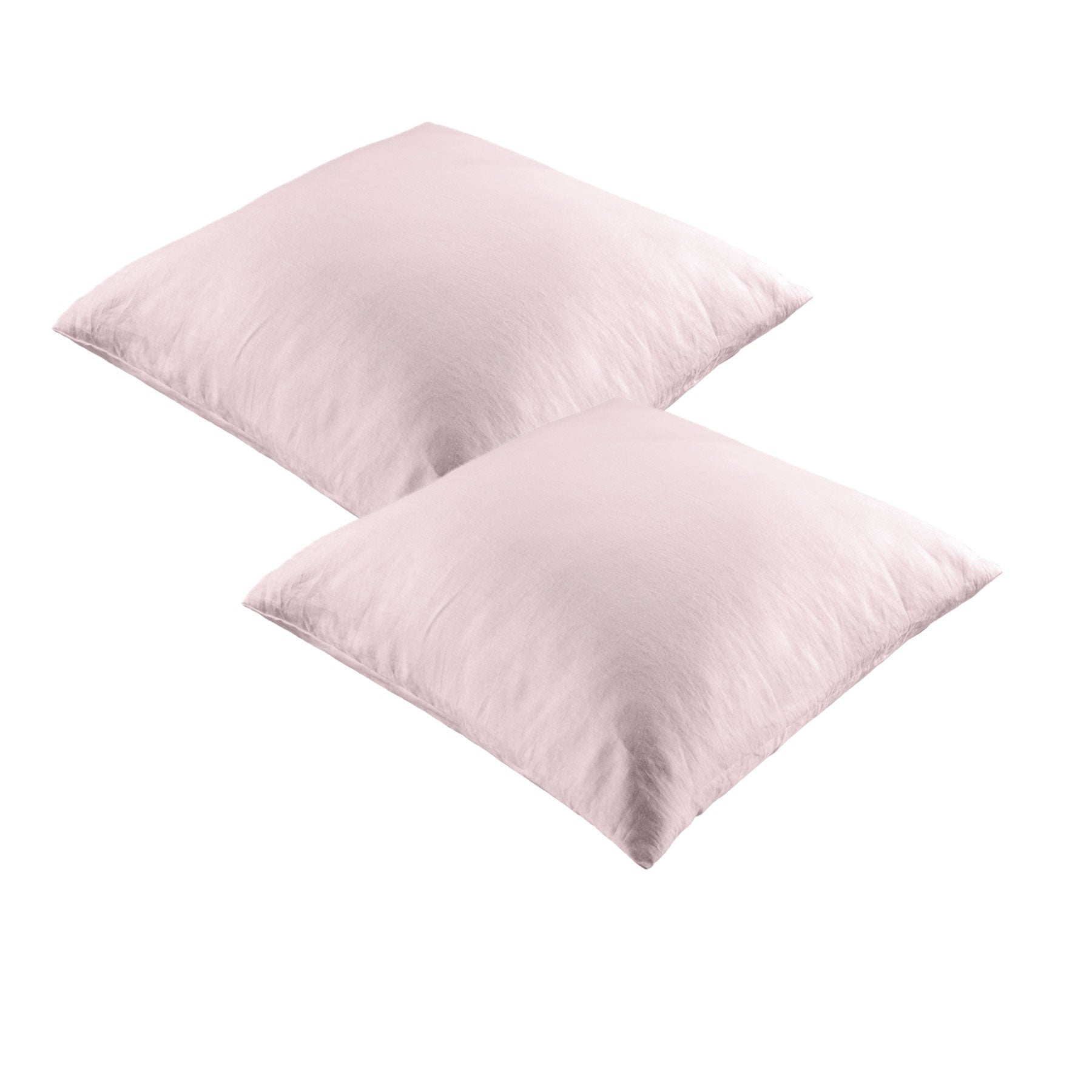 A pair of blush-colored European pillowcases made from 100% linen, showcasing a smooth solid color design, perfect for vintage-inspired decor.