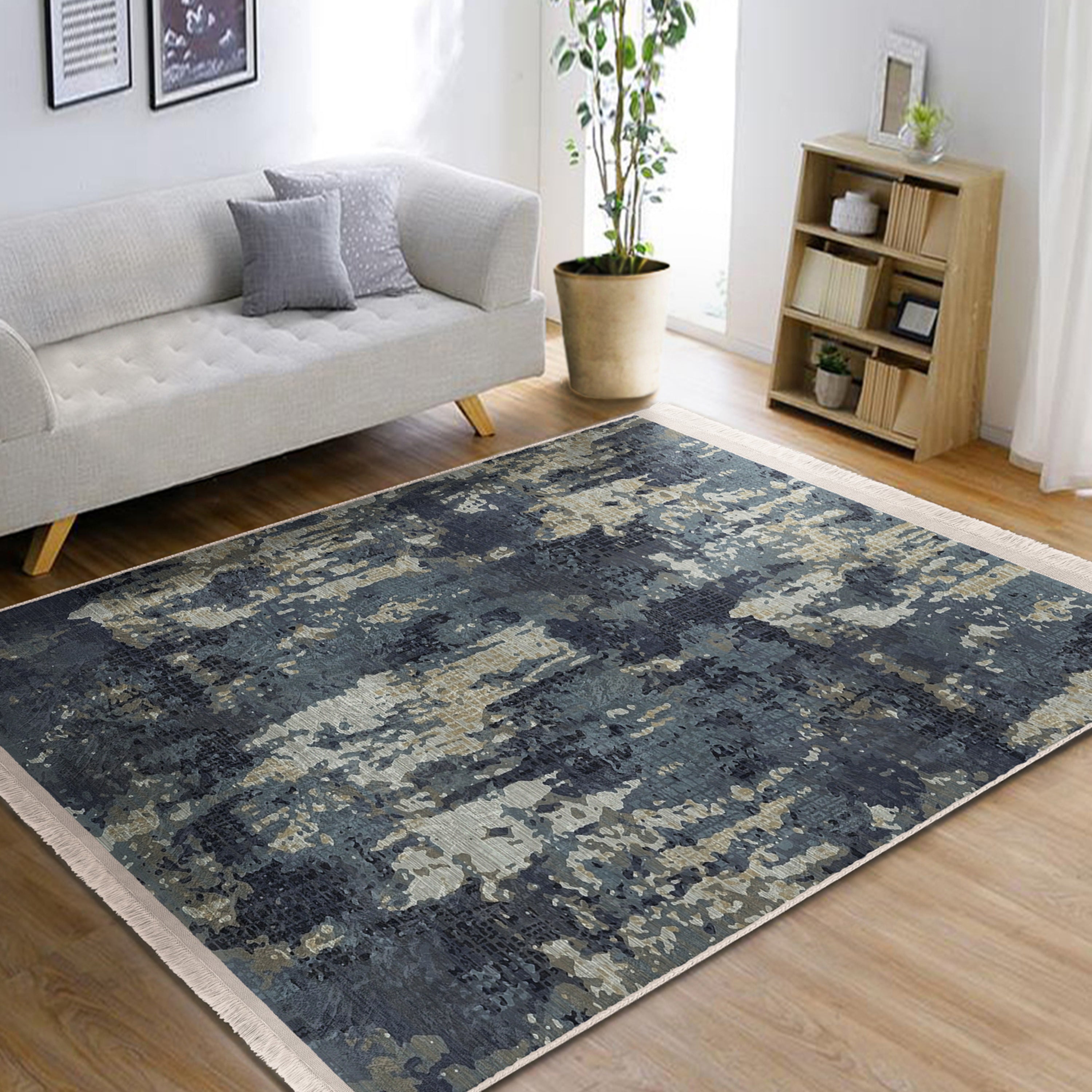 A vintage style washable area rug featuring elegant patterns and fringes, perfect for home decor.