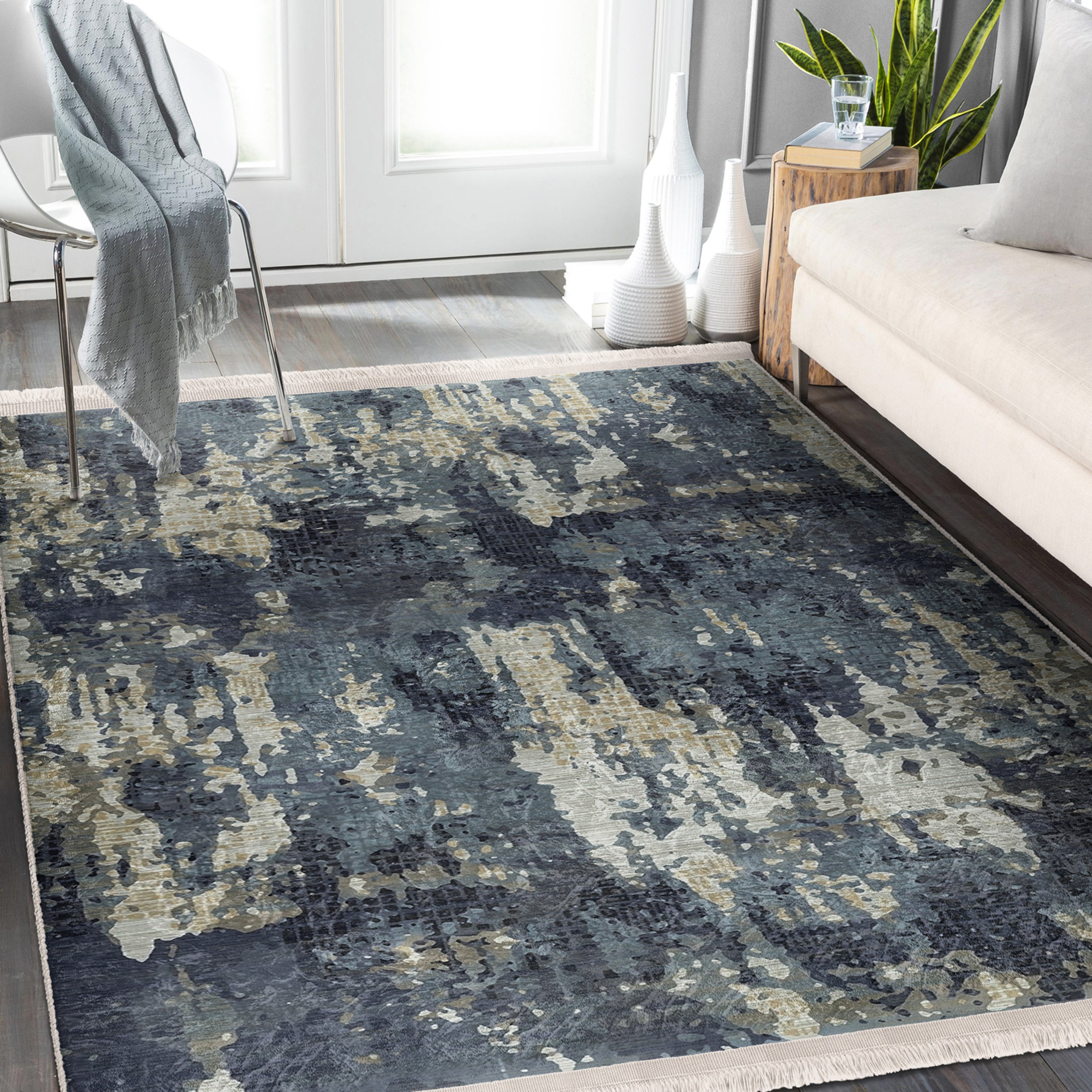 A vintage style washable area rug featuring elegant patterns and fringes, perfect for home decor.