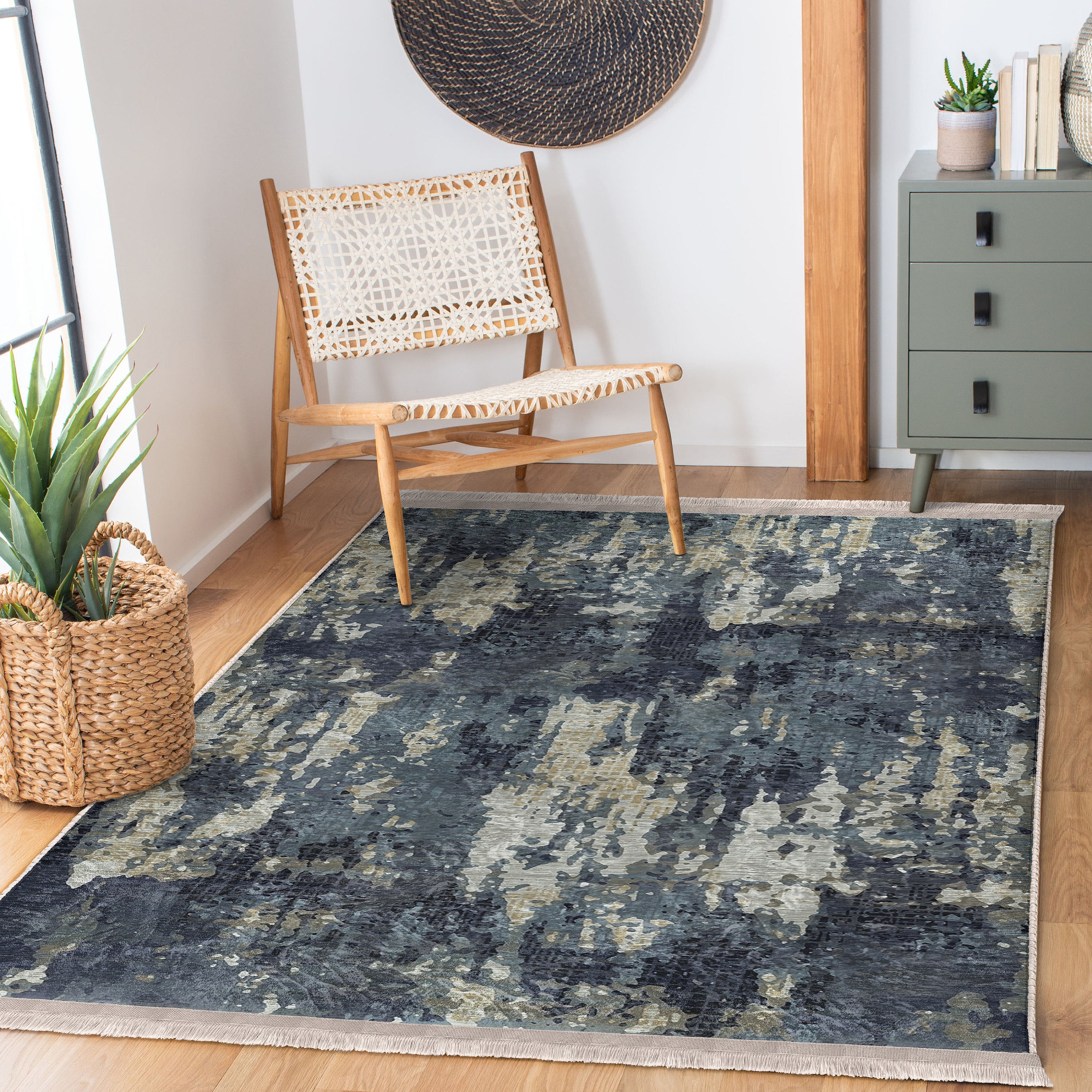 A vintage style washable area rug featuring elegant patterns and fringes, perfect for home decor.