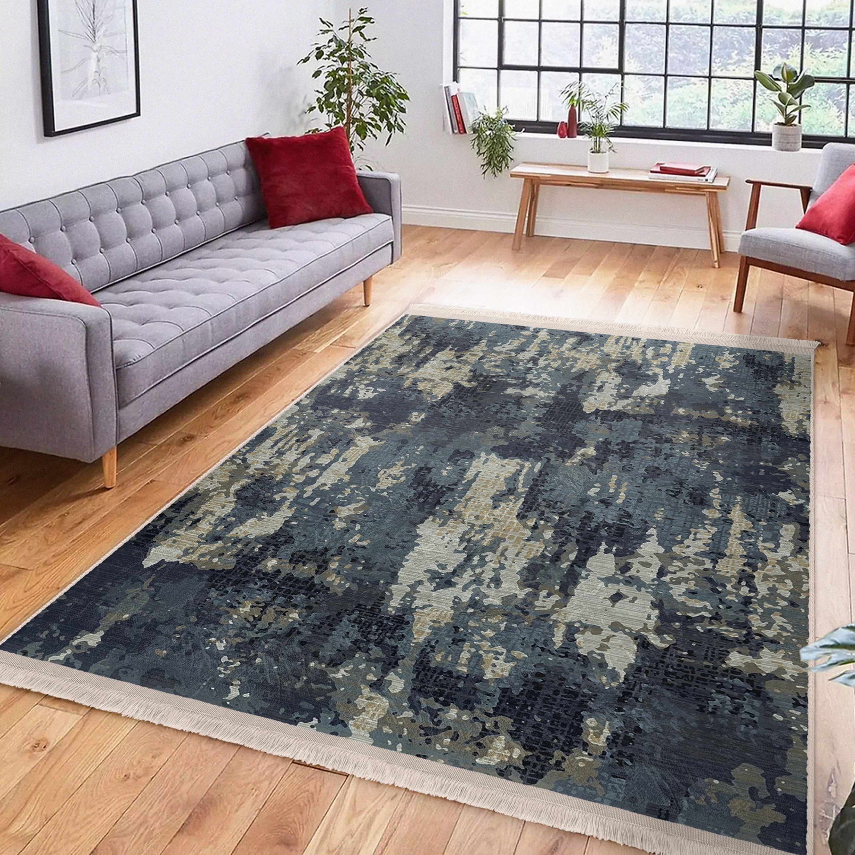 A vintage style washable area rug featuring elegant patterns and fringes, perfect for home decor.