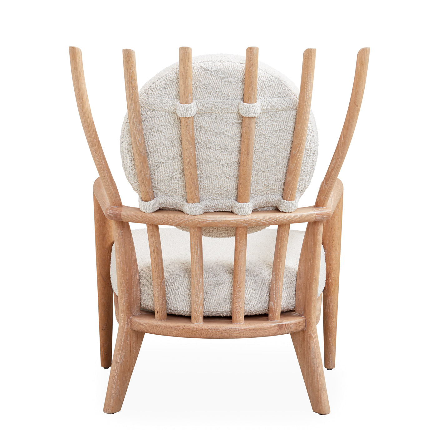 Voltaire Lounge Chair featuring a solid turned oak frame and oatmeal bouclé upholstery, showcasing a stylish and comfortable design.