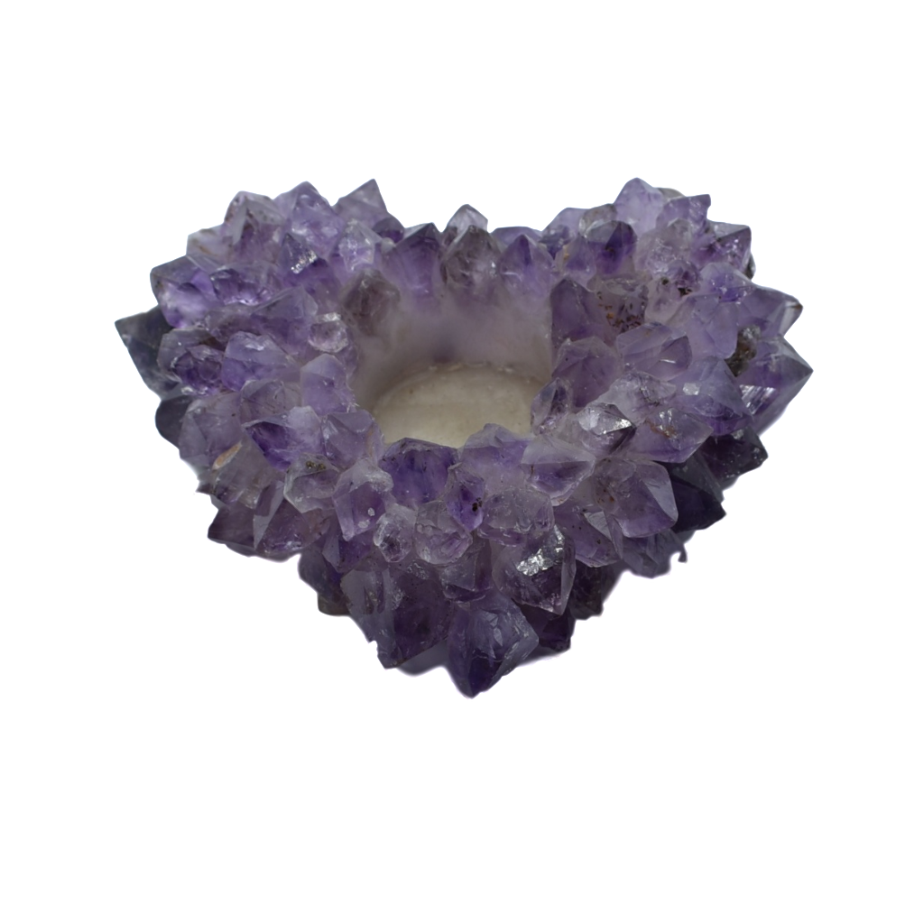 A heart-shaped crystal votive candle holder made from clear quartz, amethyst, and citrine, showcasing shimmering facets and a felt base.