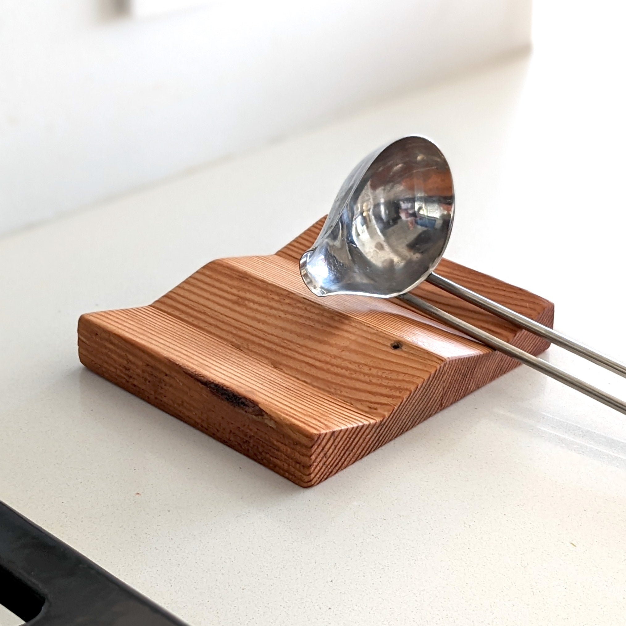 W Spoon Rest made of Doug Fir wood with beeswax finish, featuring two spaces for utensils.