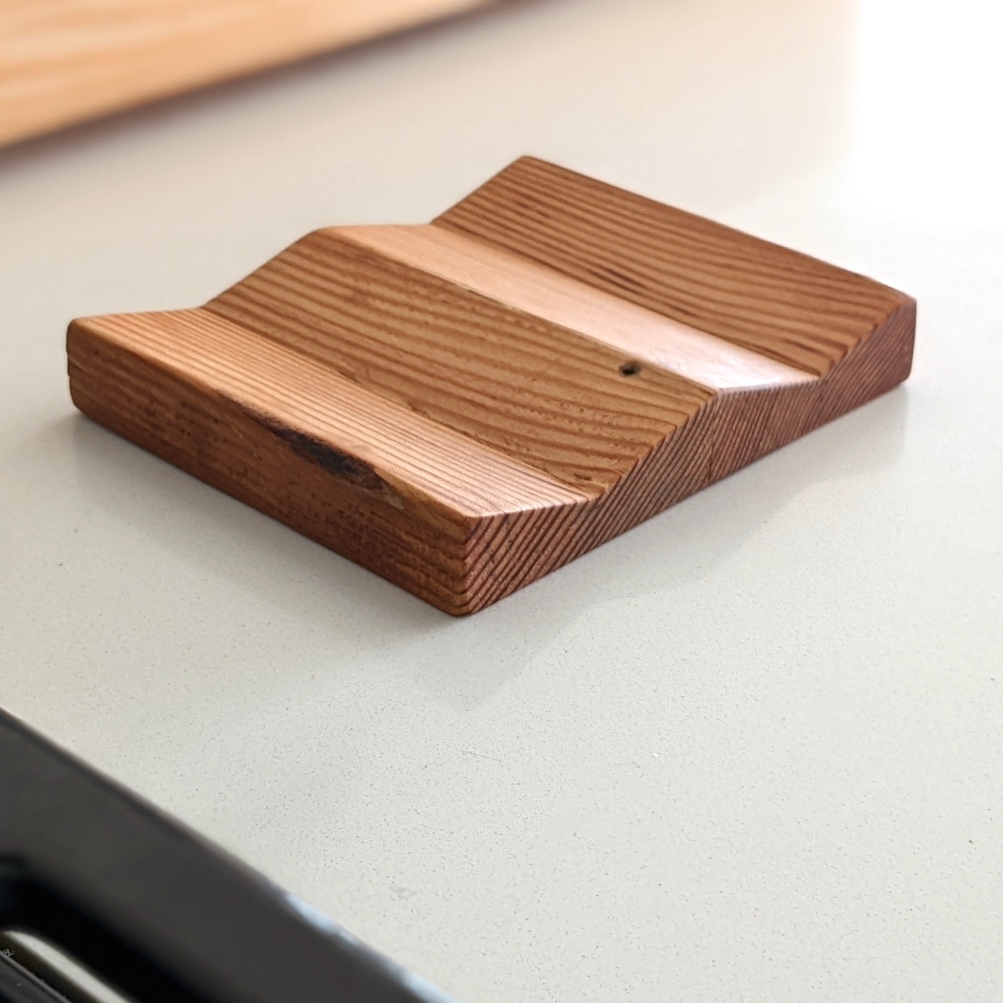 W Spoon Rest made of Doug Fir wood with beeswax finish, featuring two spaces for utensils.