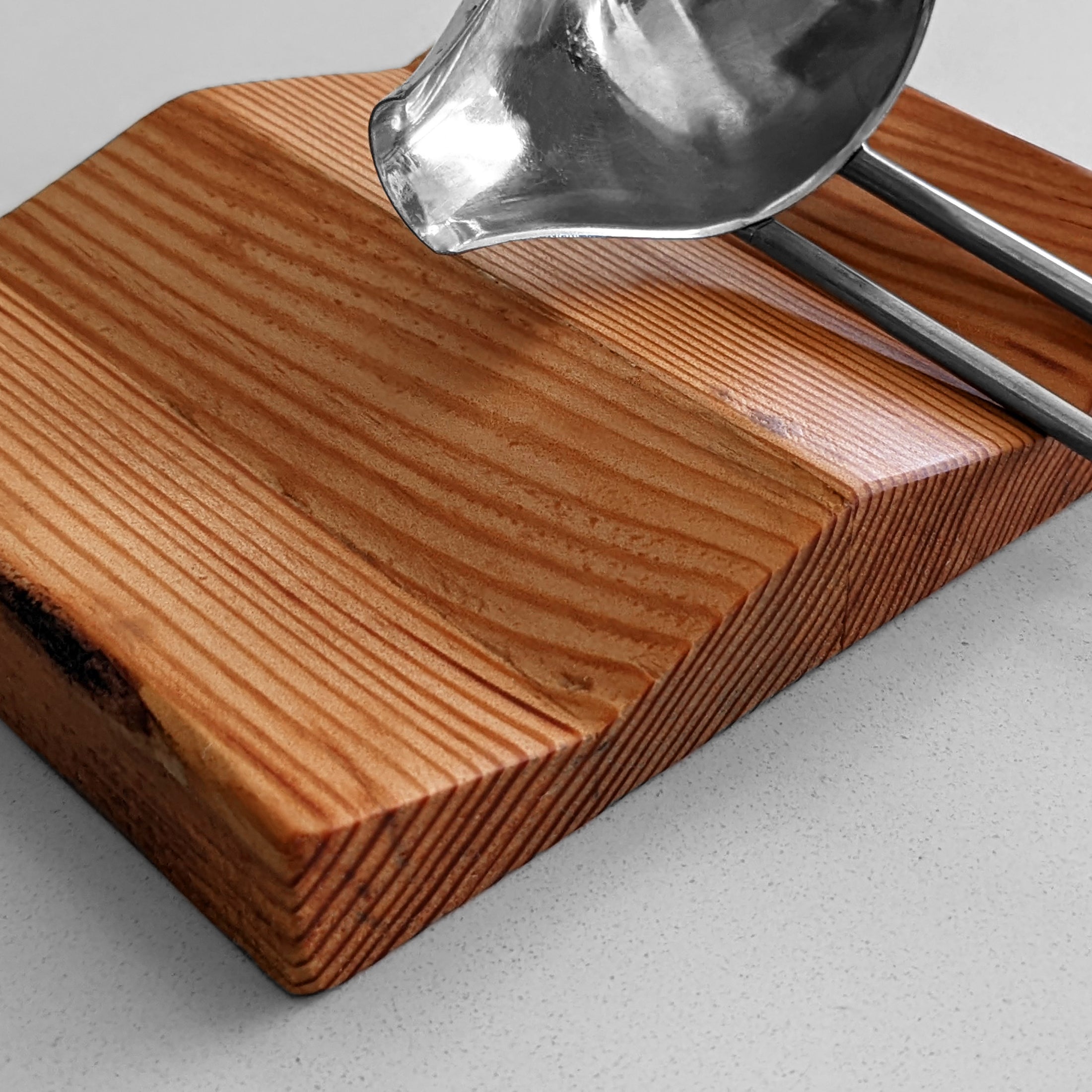 W Spoon Rest made of Doug Fir wood with beeswax finish, featuring two spaces for utensils.