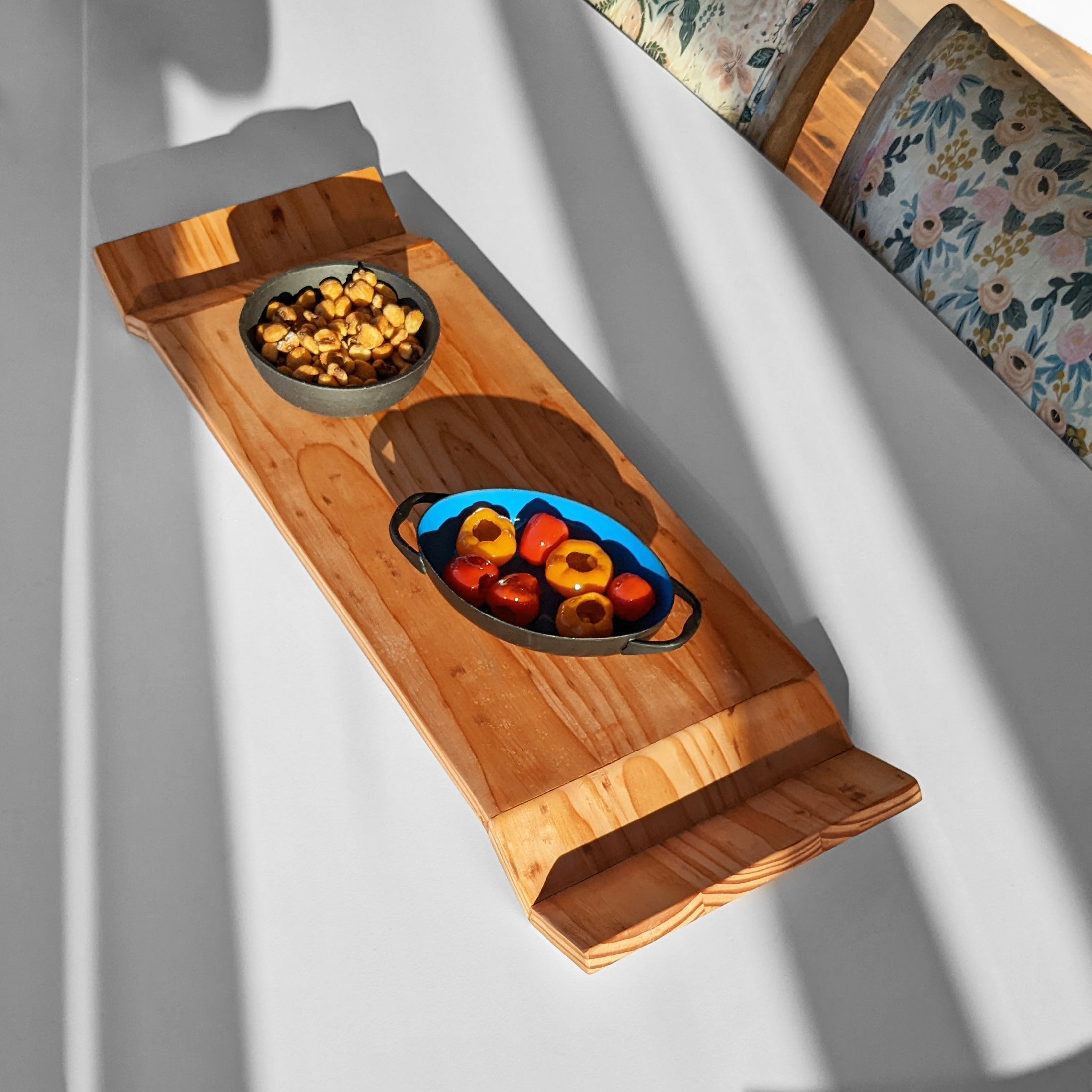 W Tray made of Doug Fir wood with beeswax finish, elegantly designed for serving food.