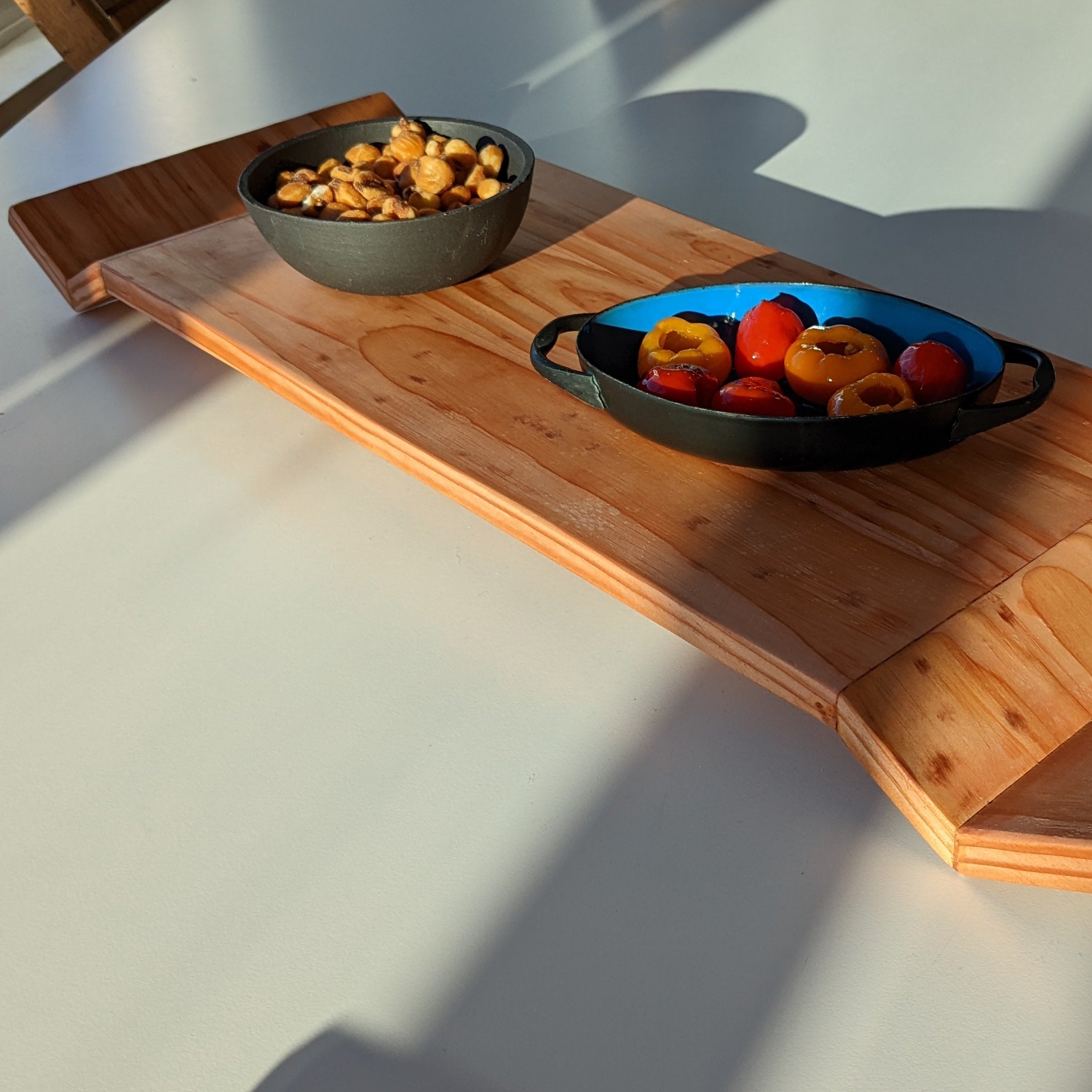 W Tray made of Doug Fir wood with beeswax finish, elegantly designed for serving food.