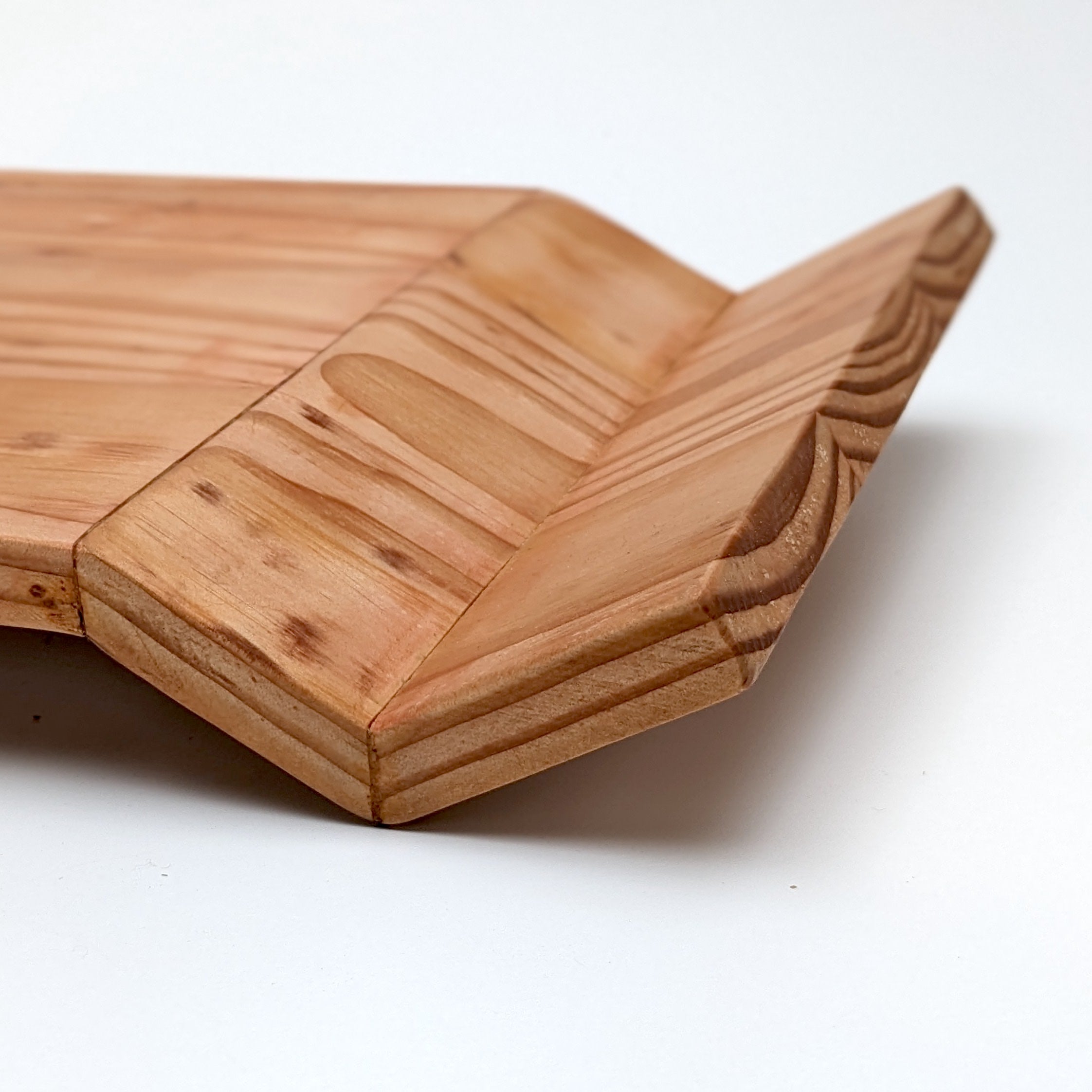 W Tray made of Doug Fir wood with beeswax finish, elegantly designed for serving food.