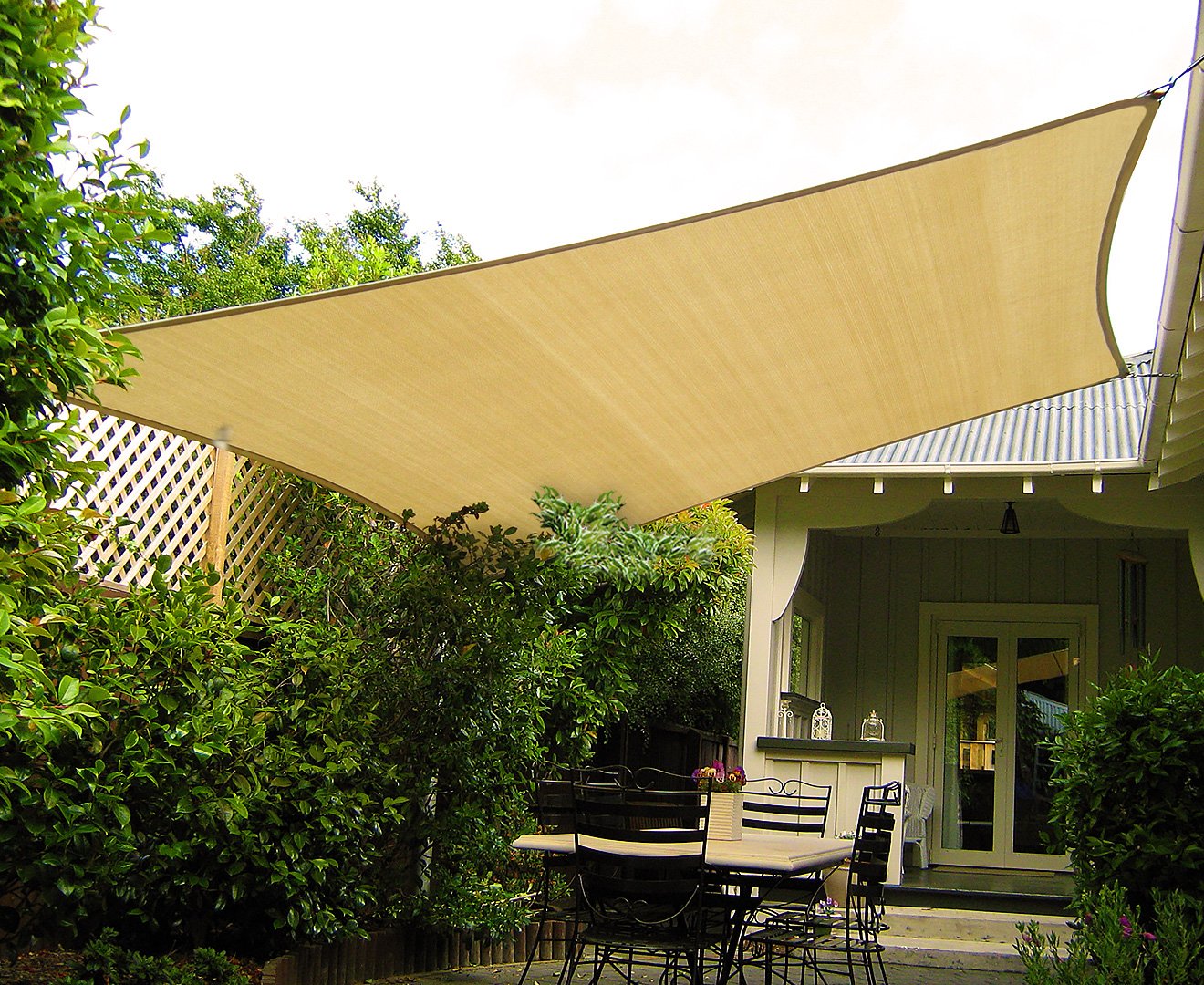 Wallaroo Rectangular Shade Sail in desert sand color, measuring 2 x 2.5m, providing shade and UV protection in an outdoor setting.