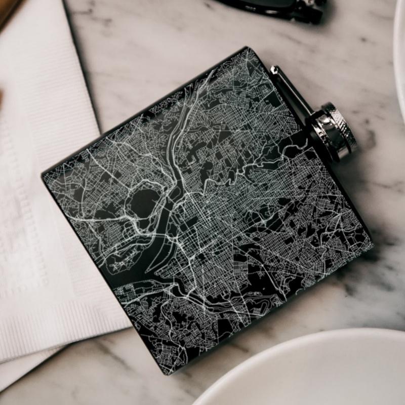 Custom engraved matte black hip flask featuring a detailed map of Washington, United States with coordinates.