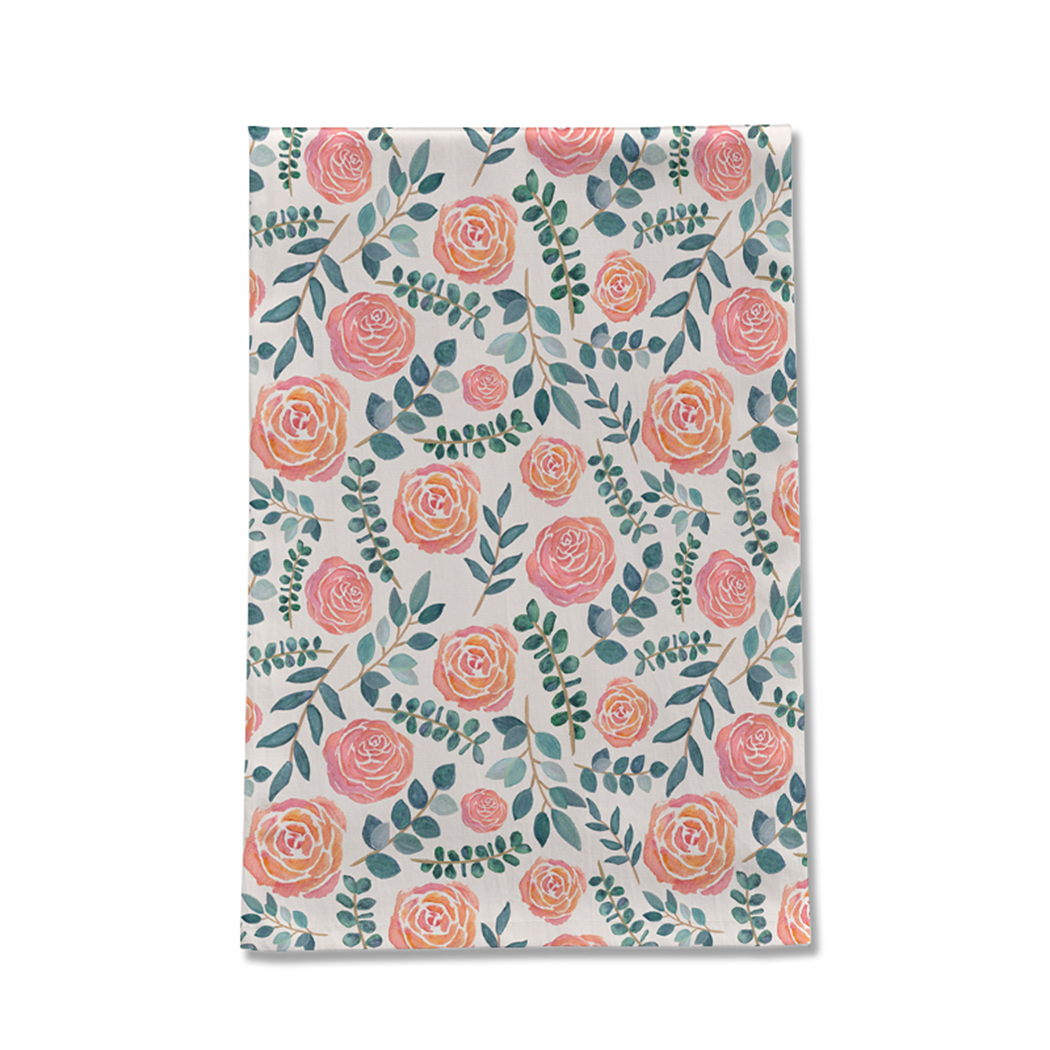 A vibrant watercolor floral tea towel made of cotton twill, featuring a beautiful floral design, perfect for kitchen decor.