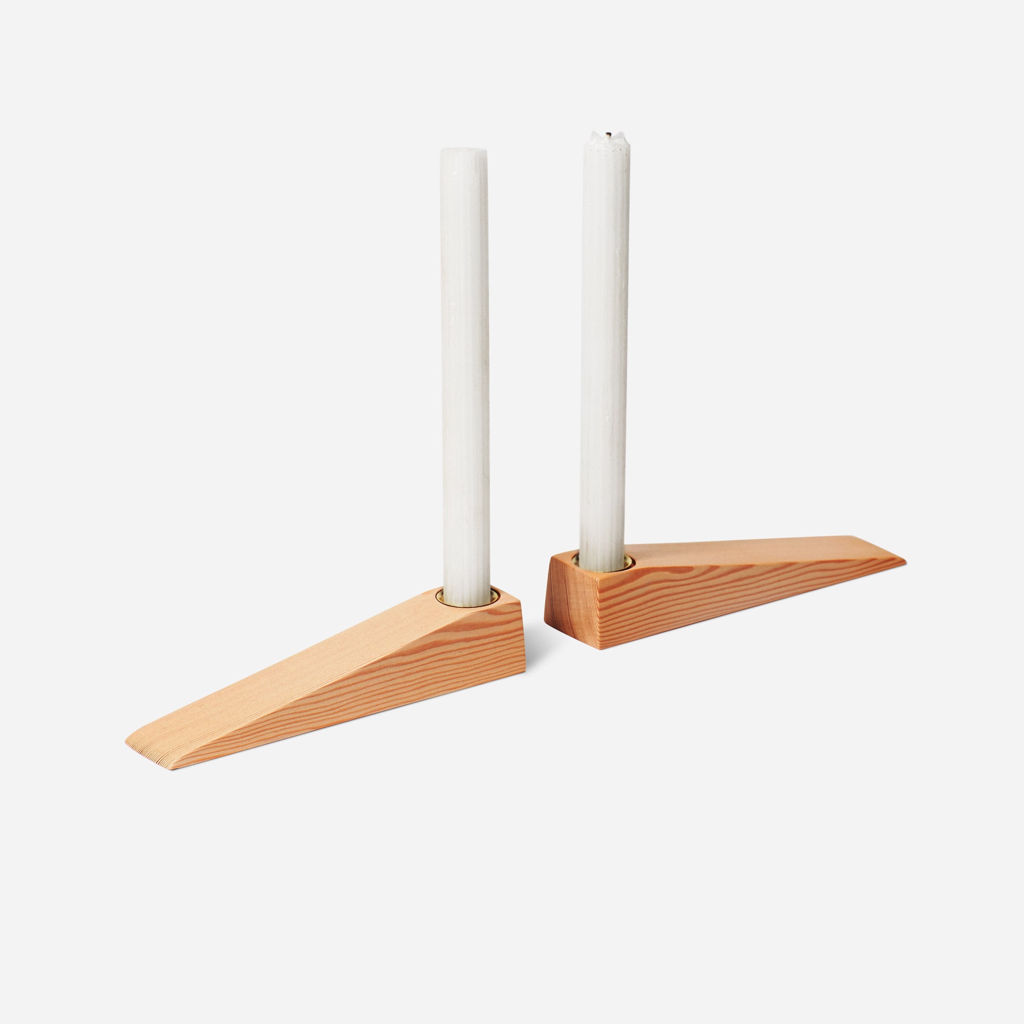 Wax On, Wax Off candle holder set featuring a sleek tapered design in natural wood finish, perfect for elegant dining settings.