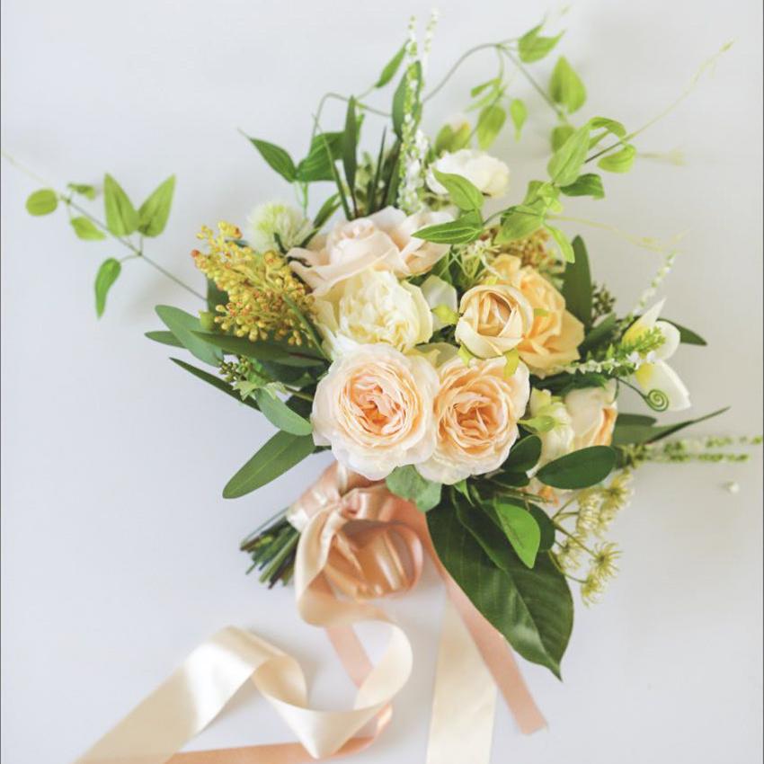 Artificial Wedding Bouquet with Champagne Roses, White Daisies, and Greenery Leaves, beautifully arranged for bridal use.