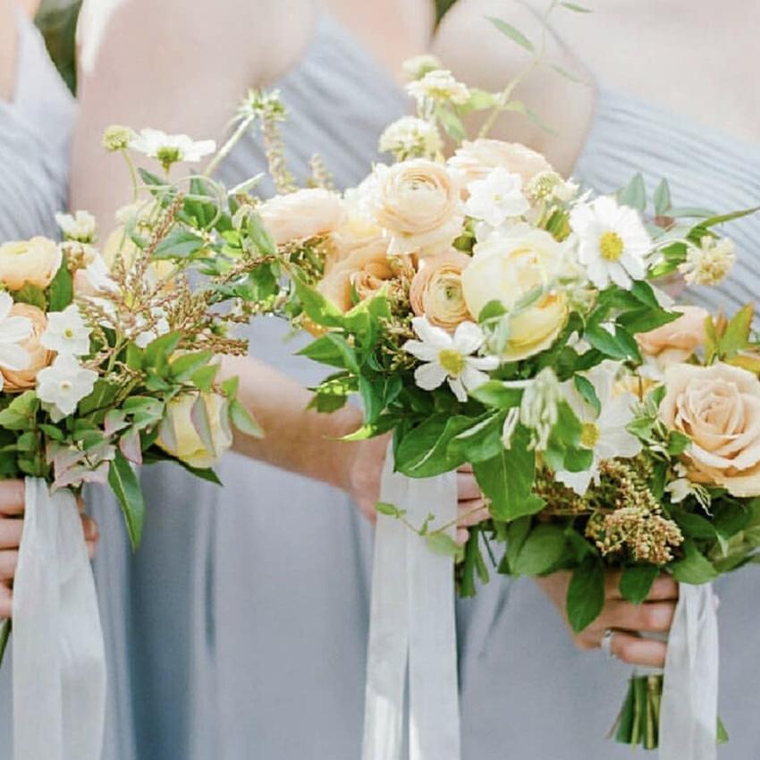 Artificial Wedding Bouquet with Champagne Roses, White Daisies, and Greenery Leaves, beautifully arranged for bridal use.