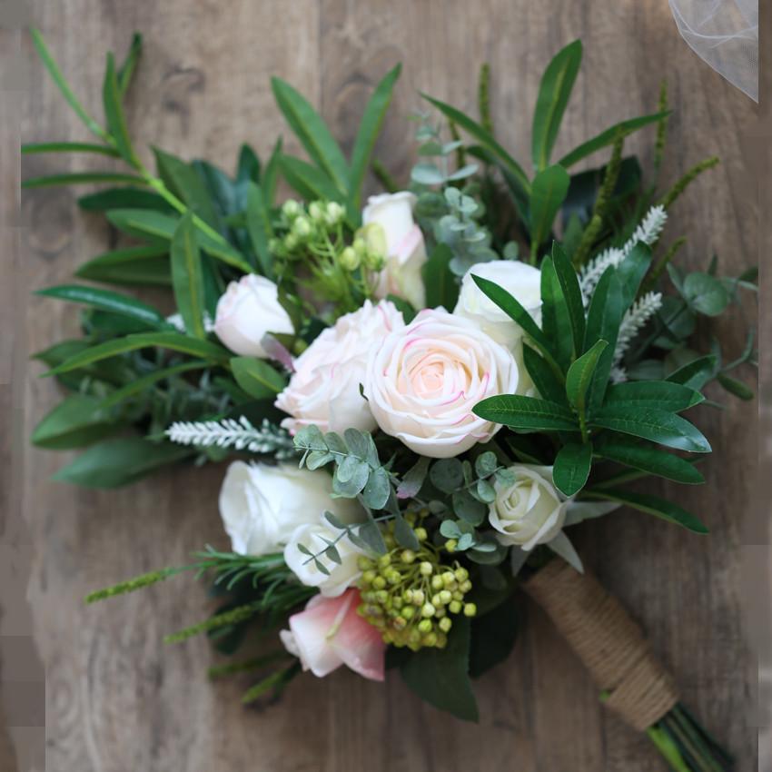 A beautiful pink and white artificial bridal bouquet, featuring roses and greenery, standing 19.7 inches tall, perfect for weddings.