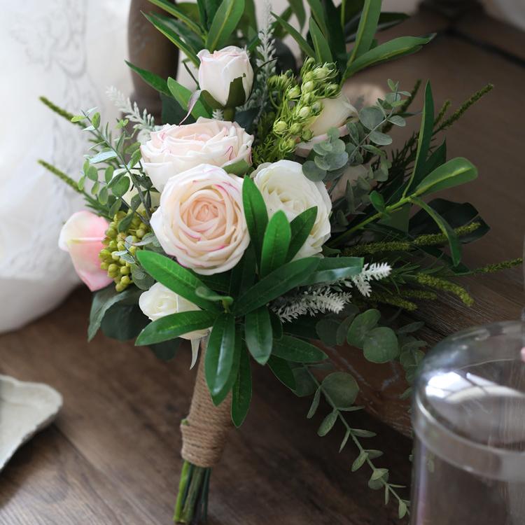 A beautiful pink and white artificial bridal bouquet, featuring roses and greenery, standing 19.7 inches tall, perfect for weddings.