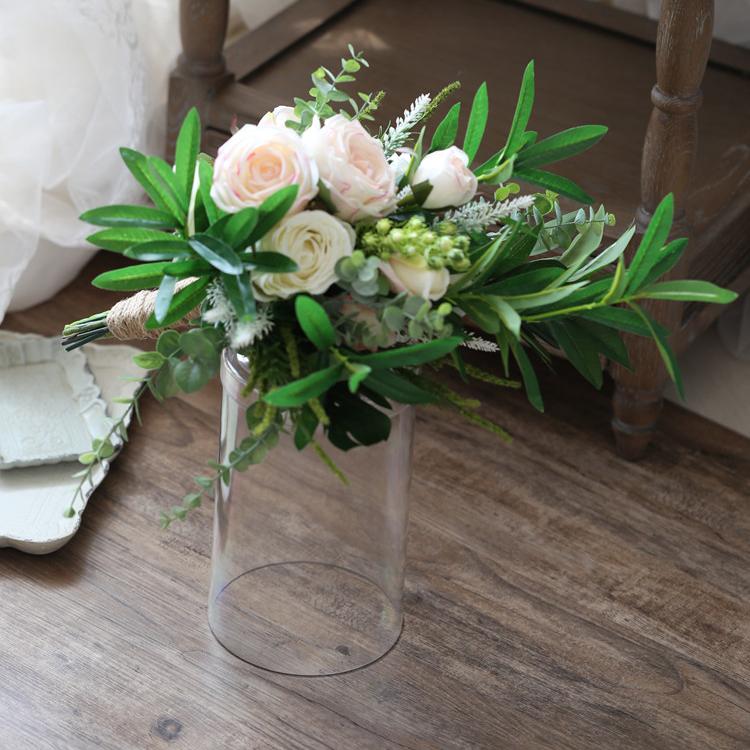 A beautiful pink and white artificial bridal bouquet, featuring roses and greenery, standing 19.7 inches tall, perfect for weddings.