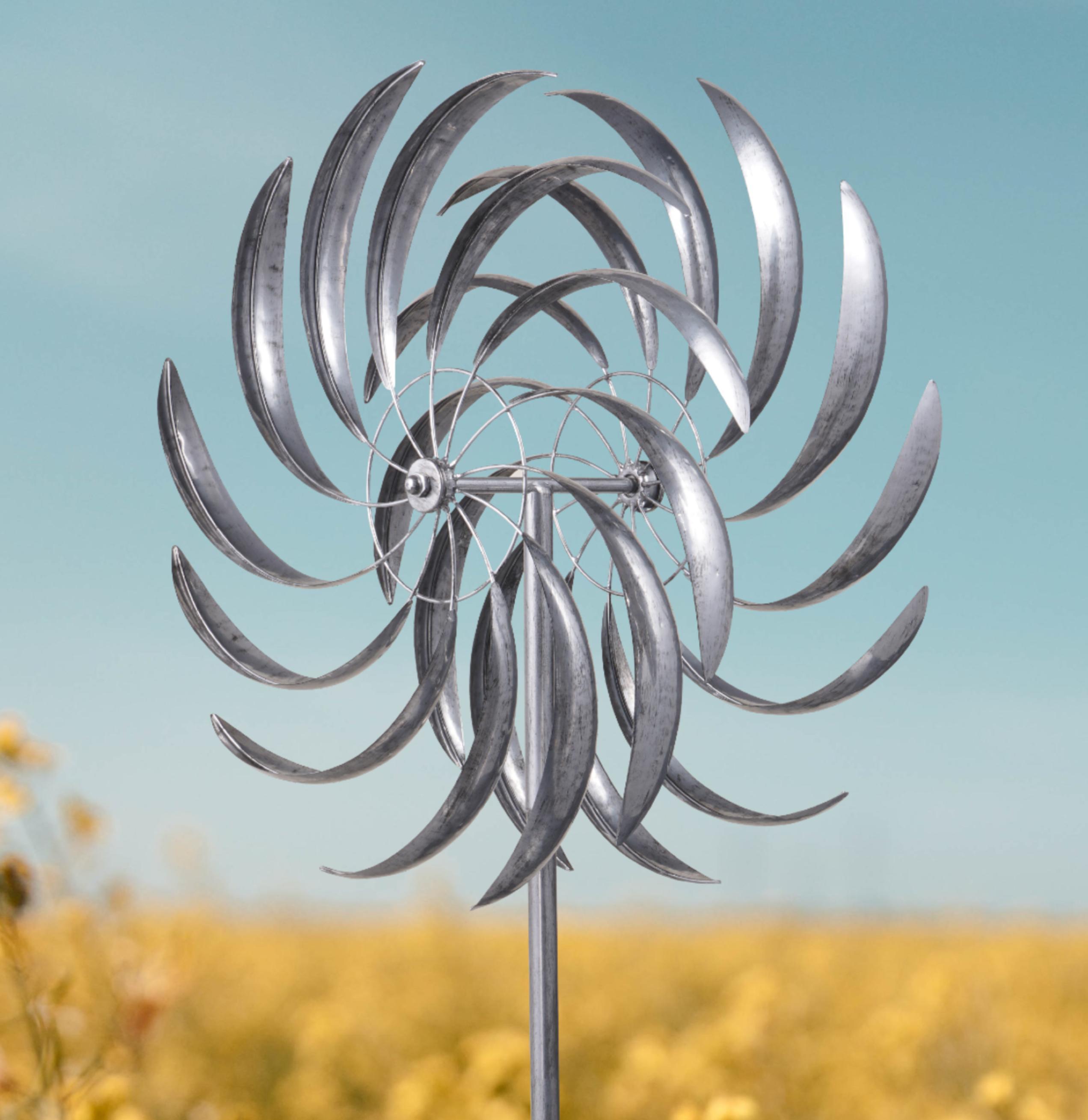 Wembury garden wind sculpture spinner in silver with black accents, featuring two sails that spin in opposite directions, standing 2.13m tall.