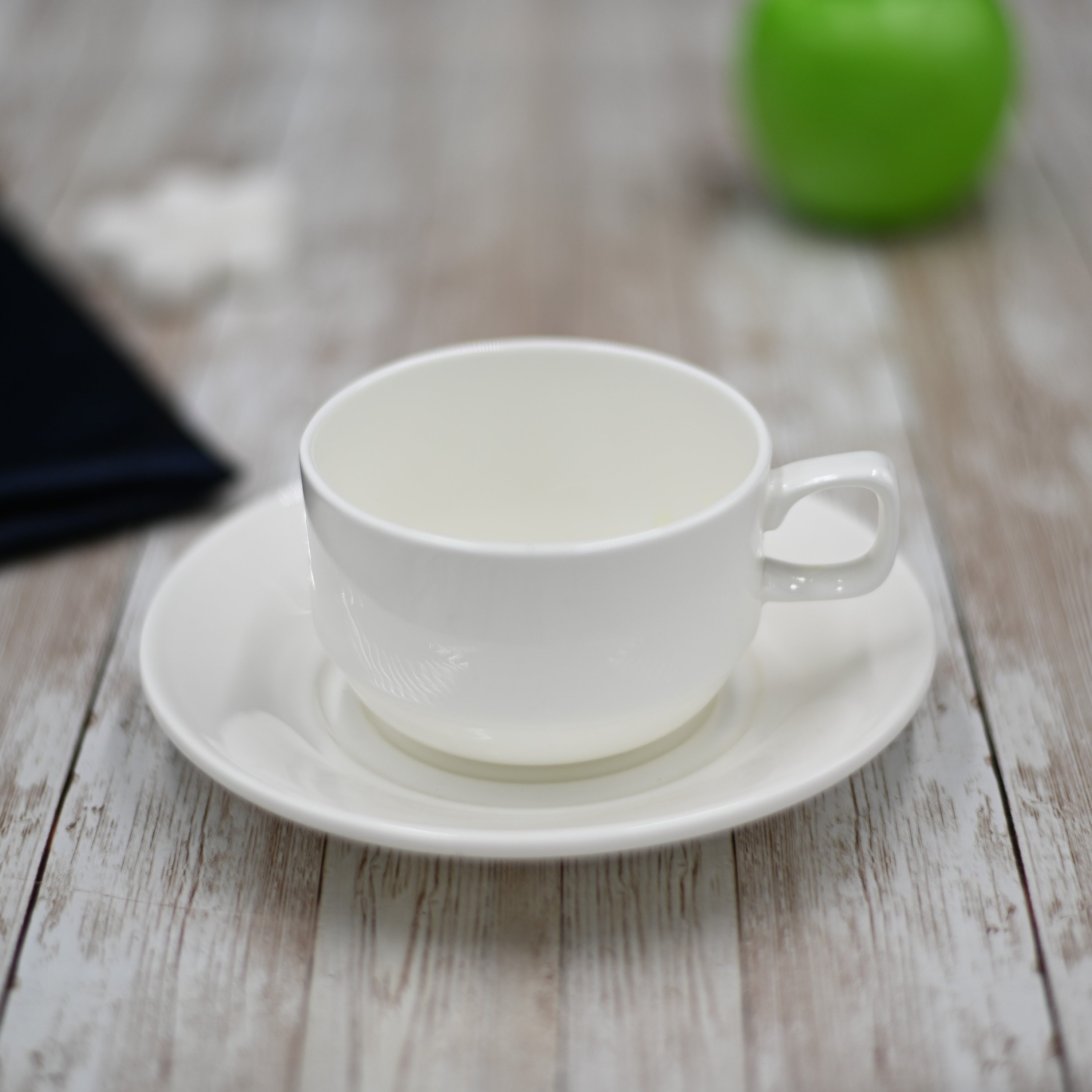 Elegant white 7 oz tea cup and saucer set made of fine porcelain, perfect for tea lovers and special occasions.