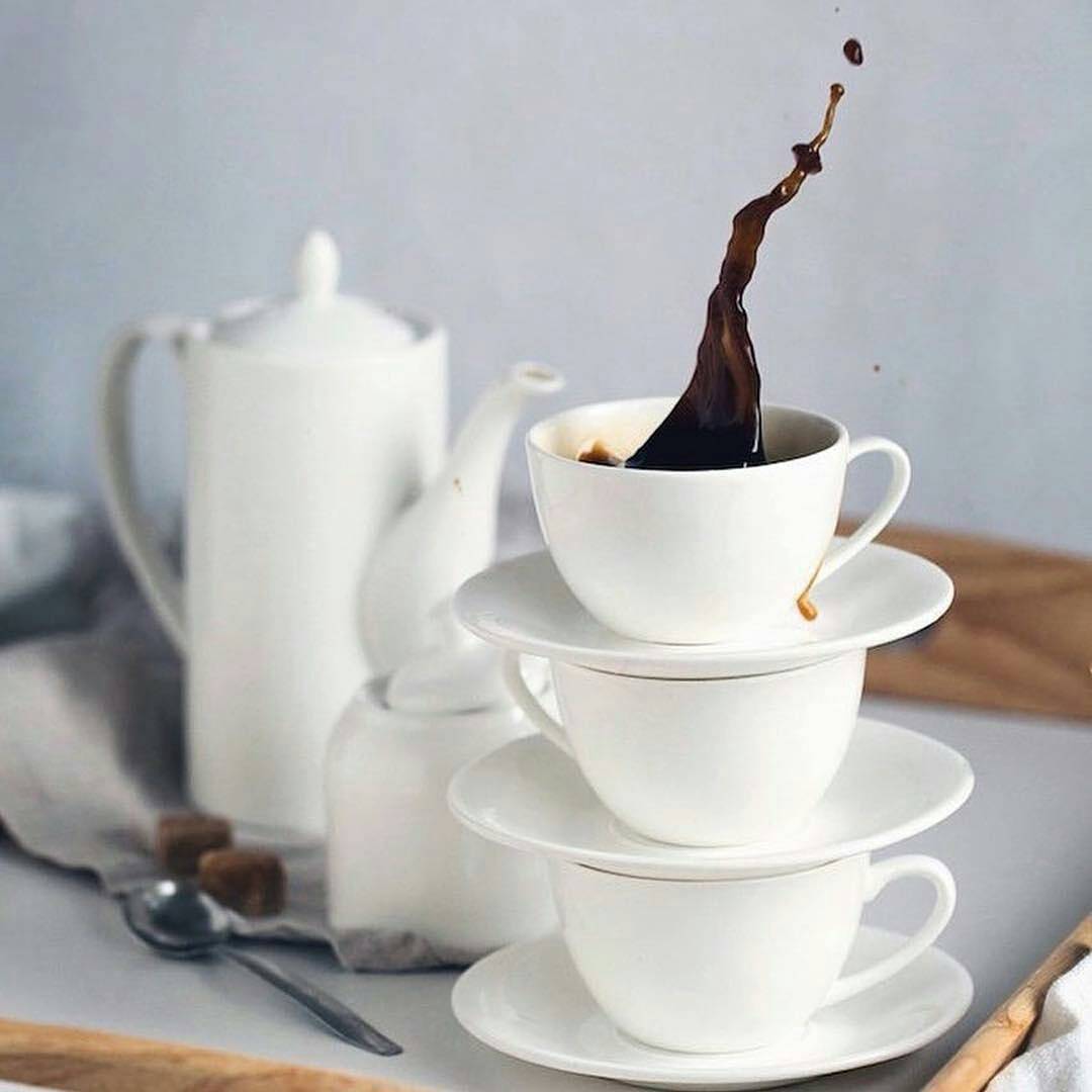 Elegant white 7 oz tea cup and saucer set made of fine porcelain, perfect for tea lovers and special occasions.