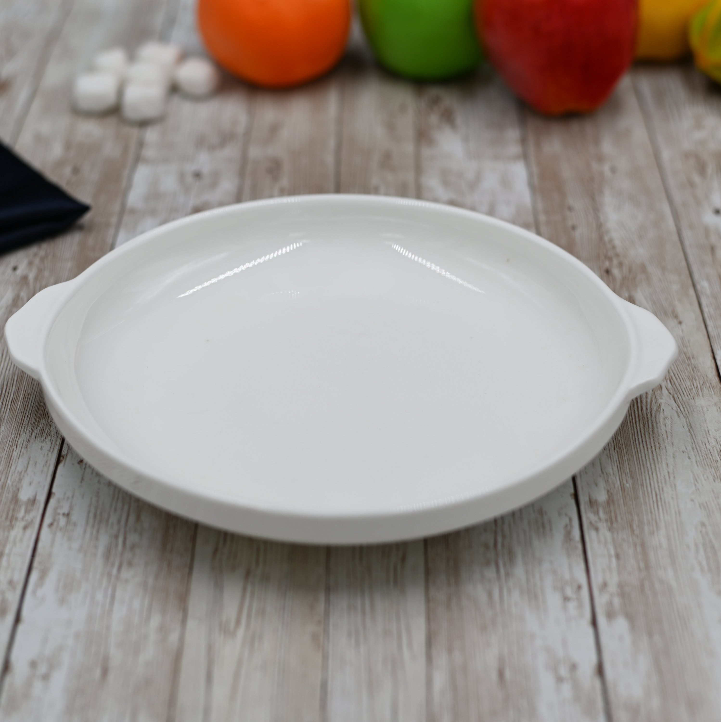 WILMAX White Baking Dish, 10 inches, oval shape, made of fine porcelain, perfect for baking and serving.