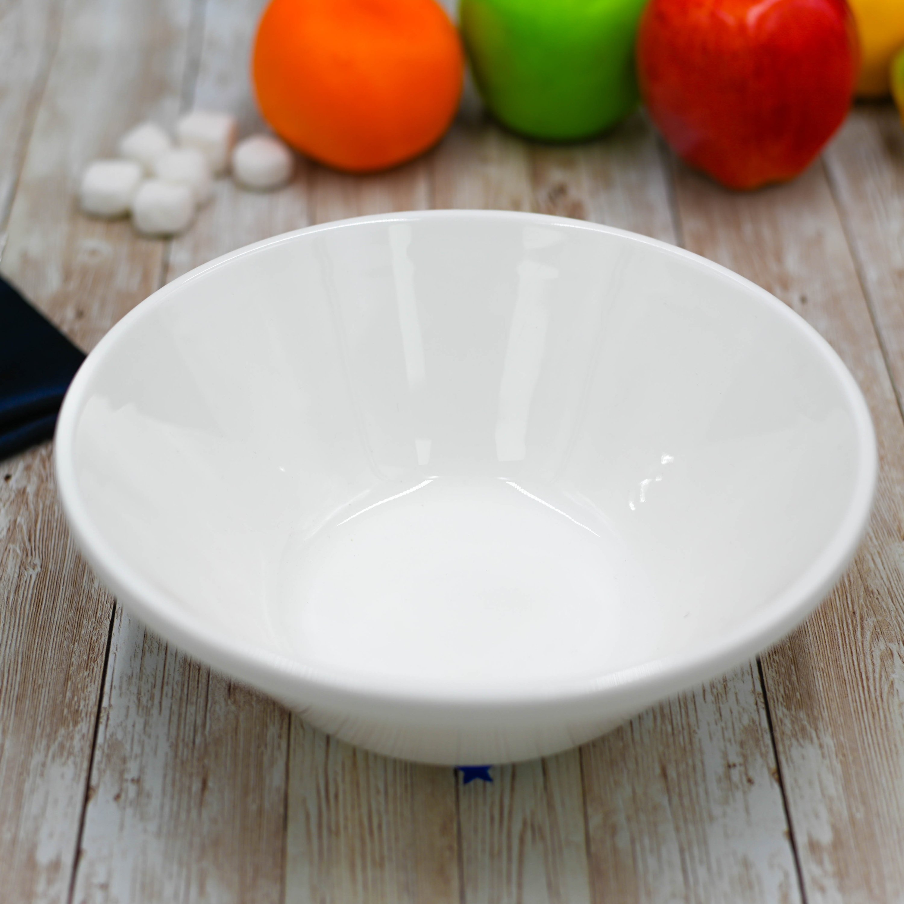 A classic 8-inch white bowl made of durable porcelain, ideal for serving soups, salads, and pasta, showcasing its elegant round design.