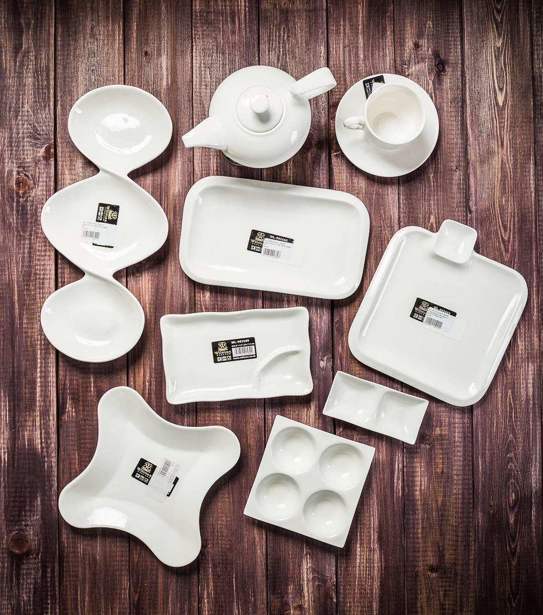 White divided sauce dish with three compartments, perfect for serving seafood and appetizers elegantly.