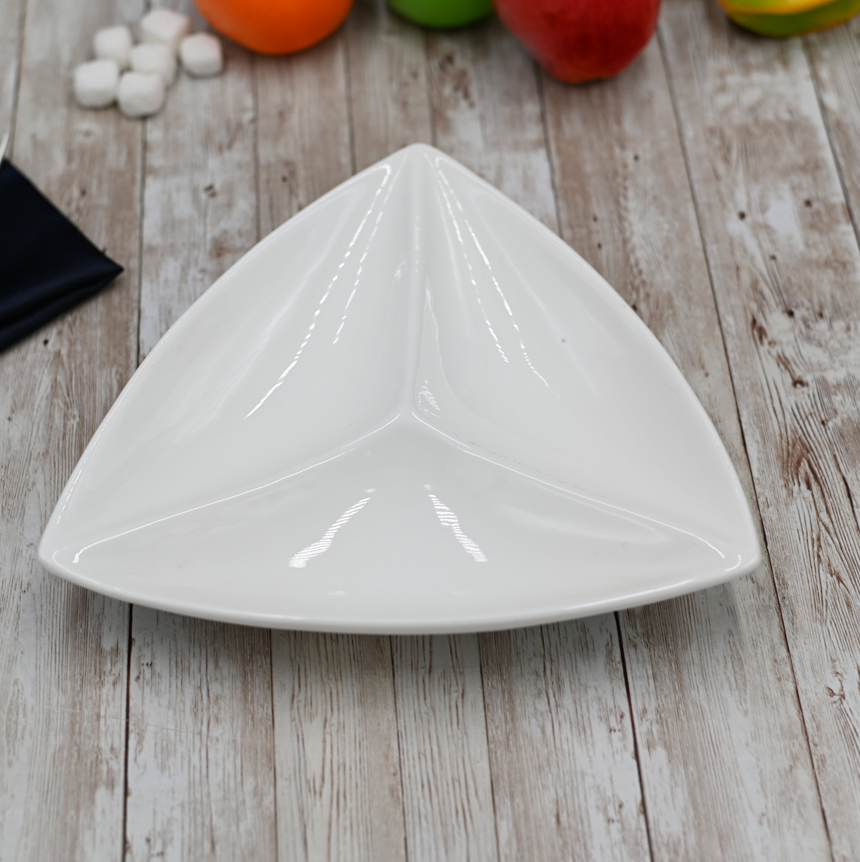 White divided triangular dish with three compartments, perfect for serving seafood and appetizers.