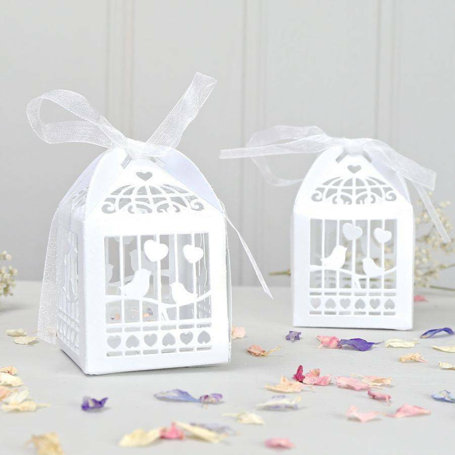 A pack of 10 elegant white dove bird boxes designed for wedding favors, featuring a heart motif.