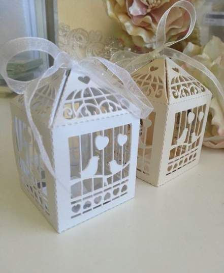 A pack of 10 elegant white dove bird boxes designed for wedding favors, featuring a heart motif.