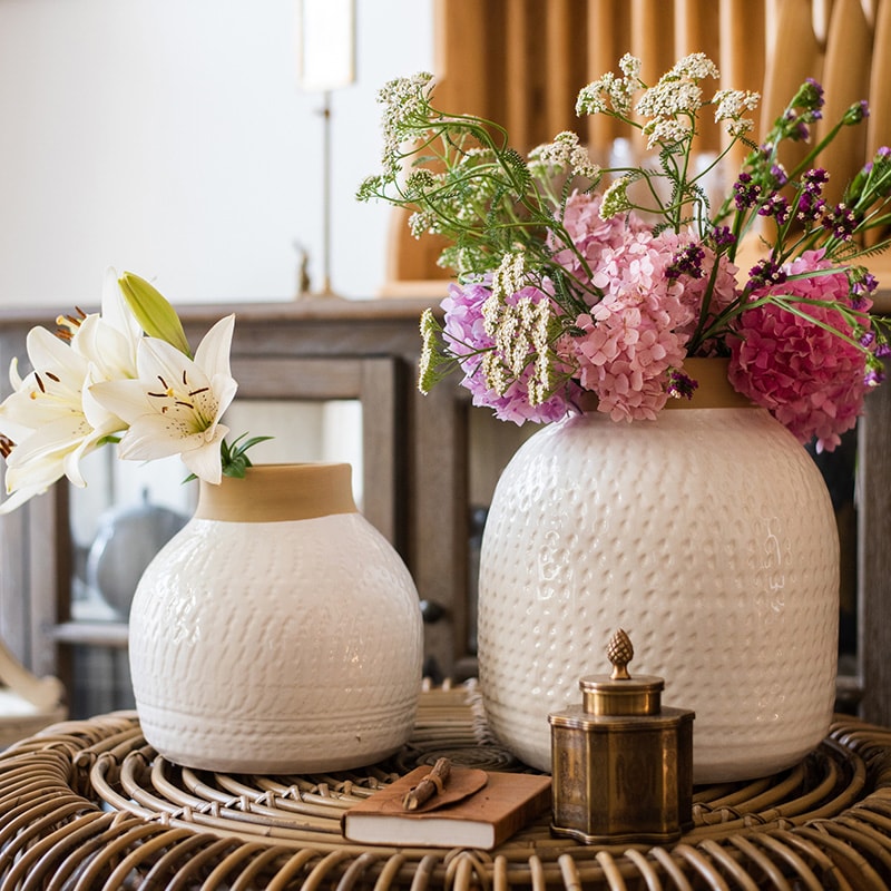 A beautifully crafted white glazed ceramic flower vase, showcasing a sleek design and handmade artistry, perfect for floral arrangements.