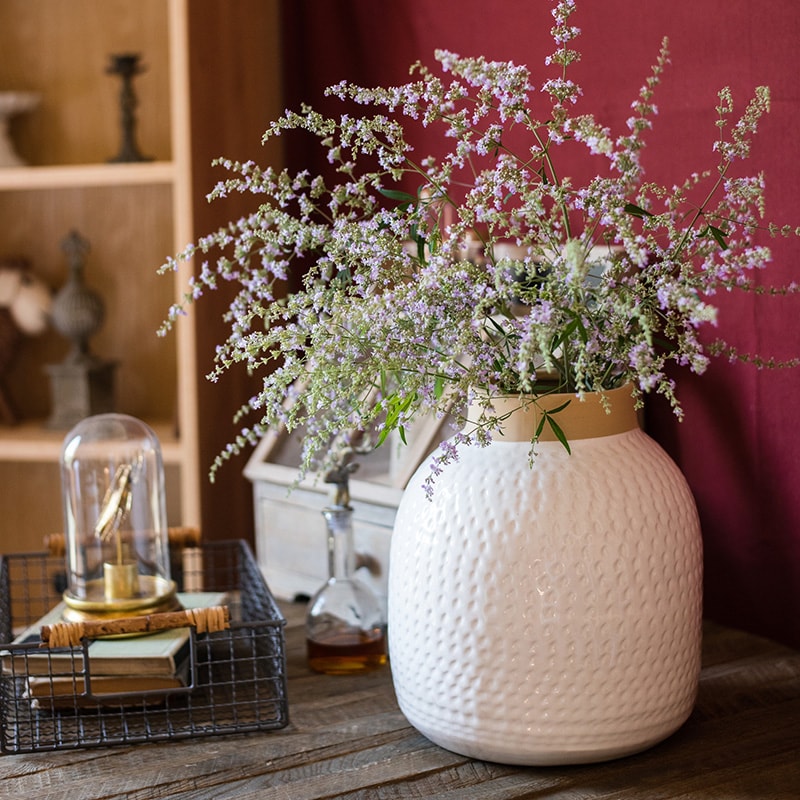 A beautifully crafted white glazed ceramic flower vase, showcasing a sleek design and handmade artistry, perfect for floral arrangements.