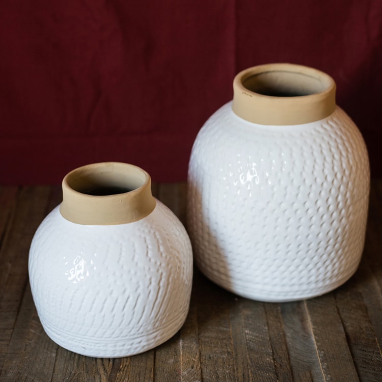 A beautifully crafted white glazed ceramic flower vase, showcasing a sleek design and handmade artistry, perfect for floral arrangements.