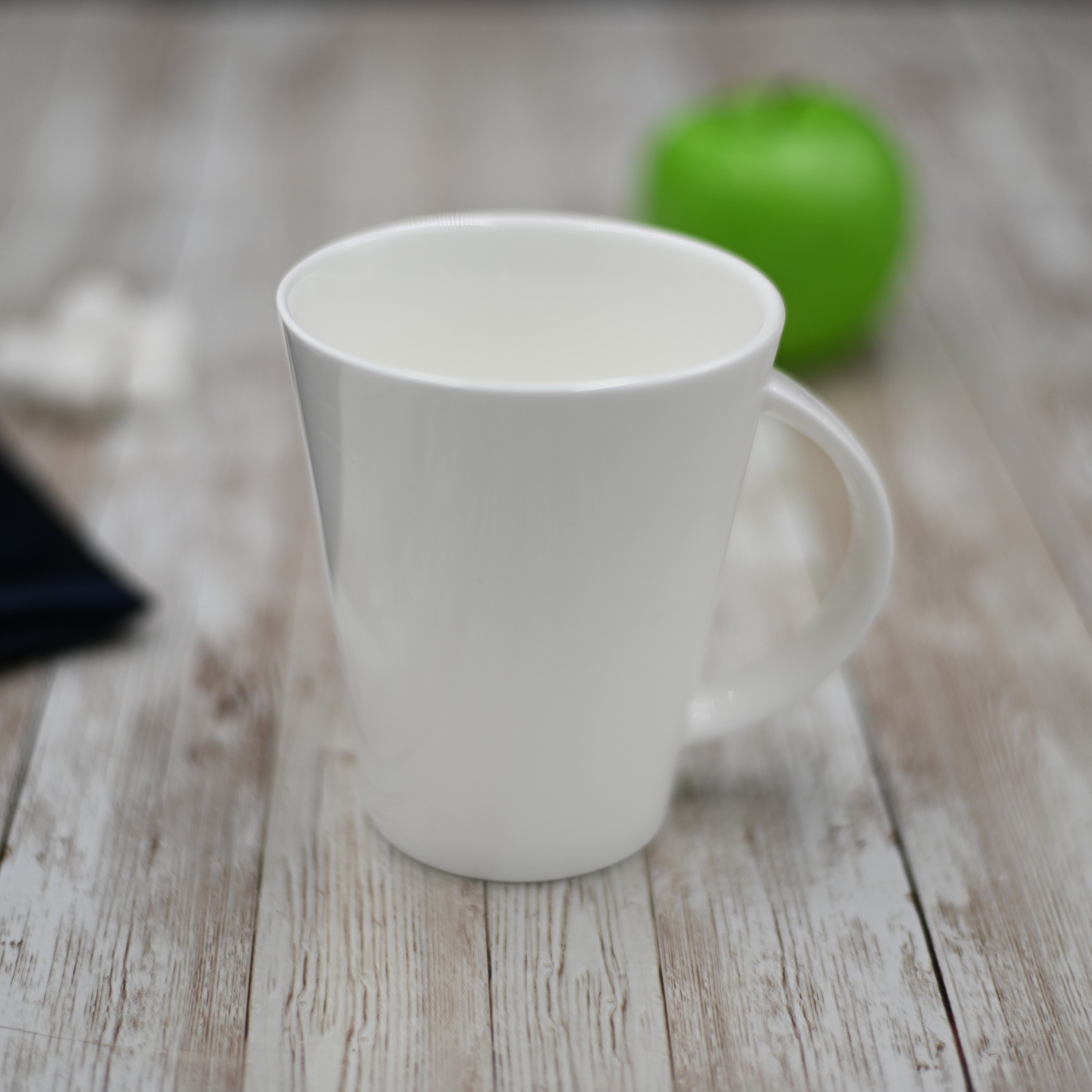 Elegant WILMAX White Mug, 13 oz, showcasing its stylish design and flawless porcelain finish.