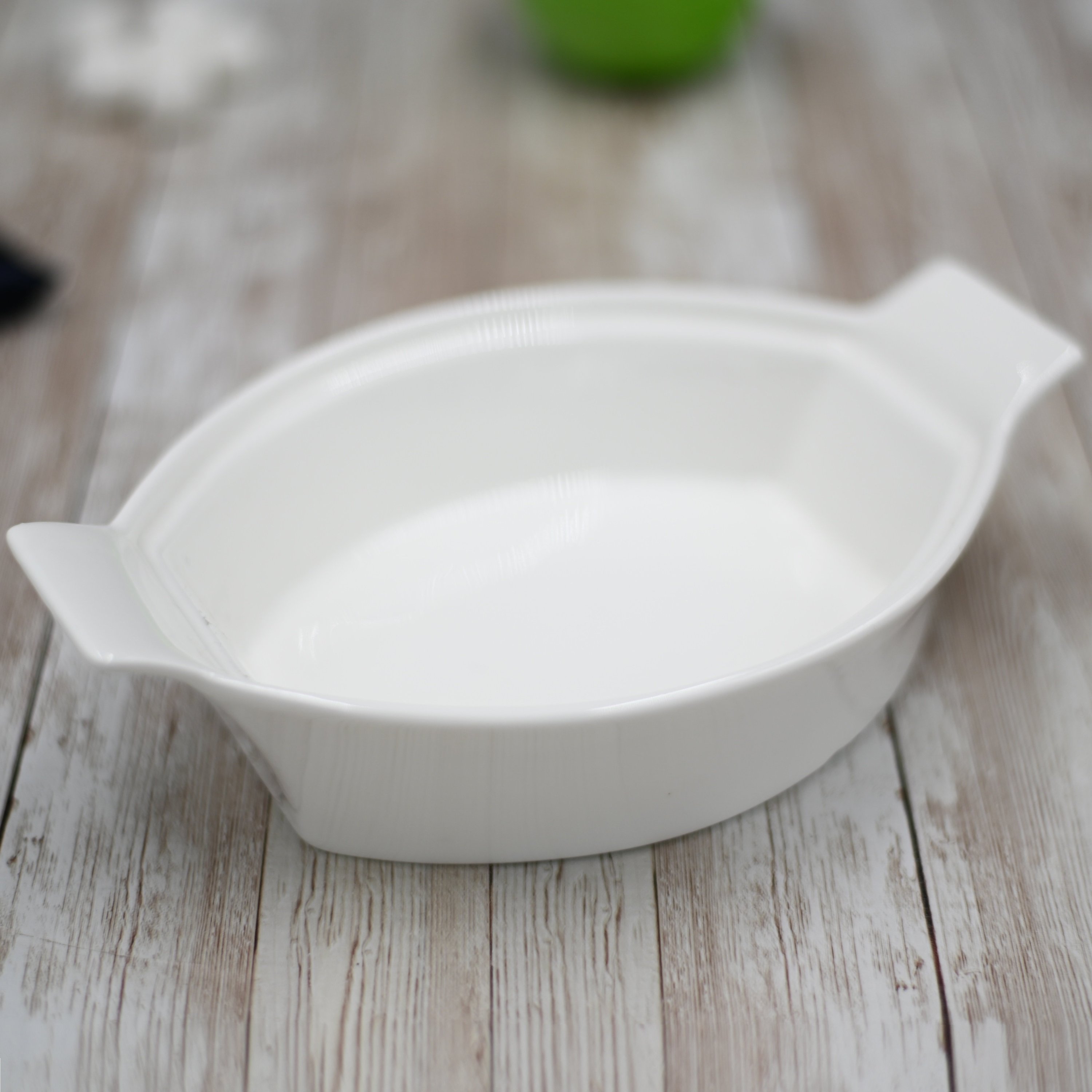 WILMAX White Oval Casserole Baking Dish, 8.5 inches, fine porcelain, elegant design for baking and serving.