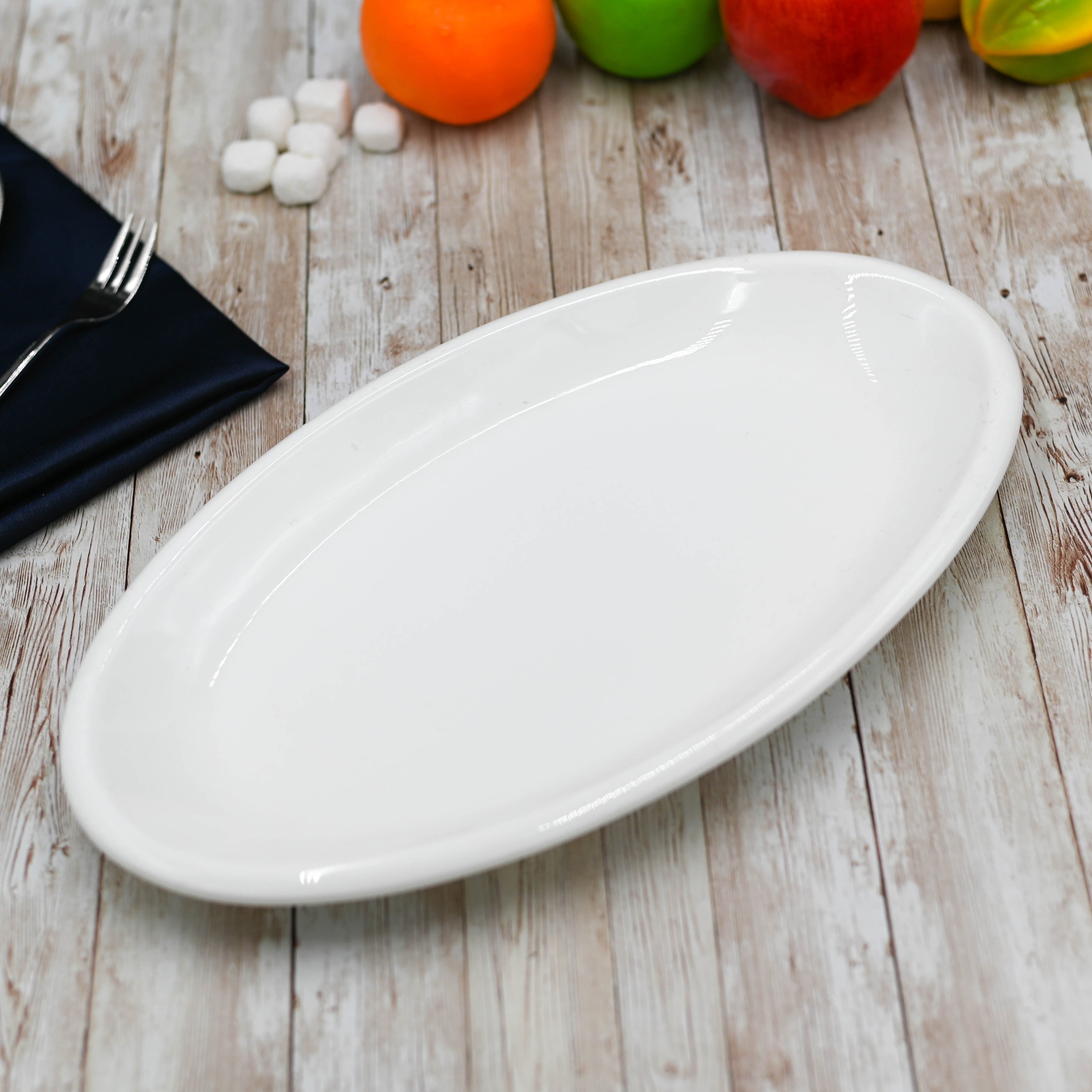 Elegant Wilmax White Oval Plate, 14.5 inches, perfect for serving various dishes.