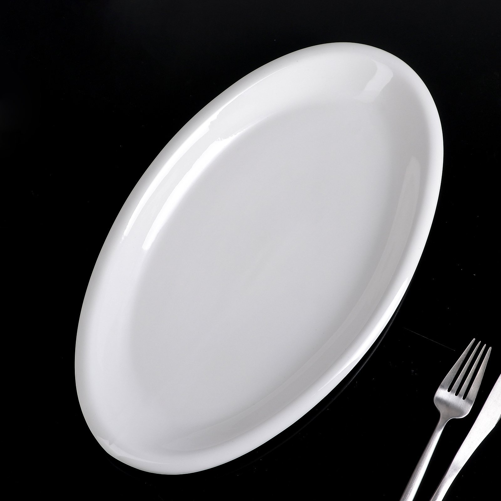 Elegant Wilmax White Oval Plate, 14.5 inches, perfect for serving various dishes.