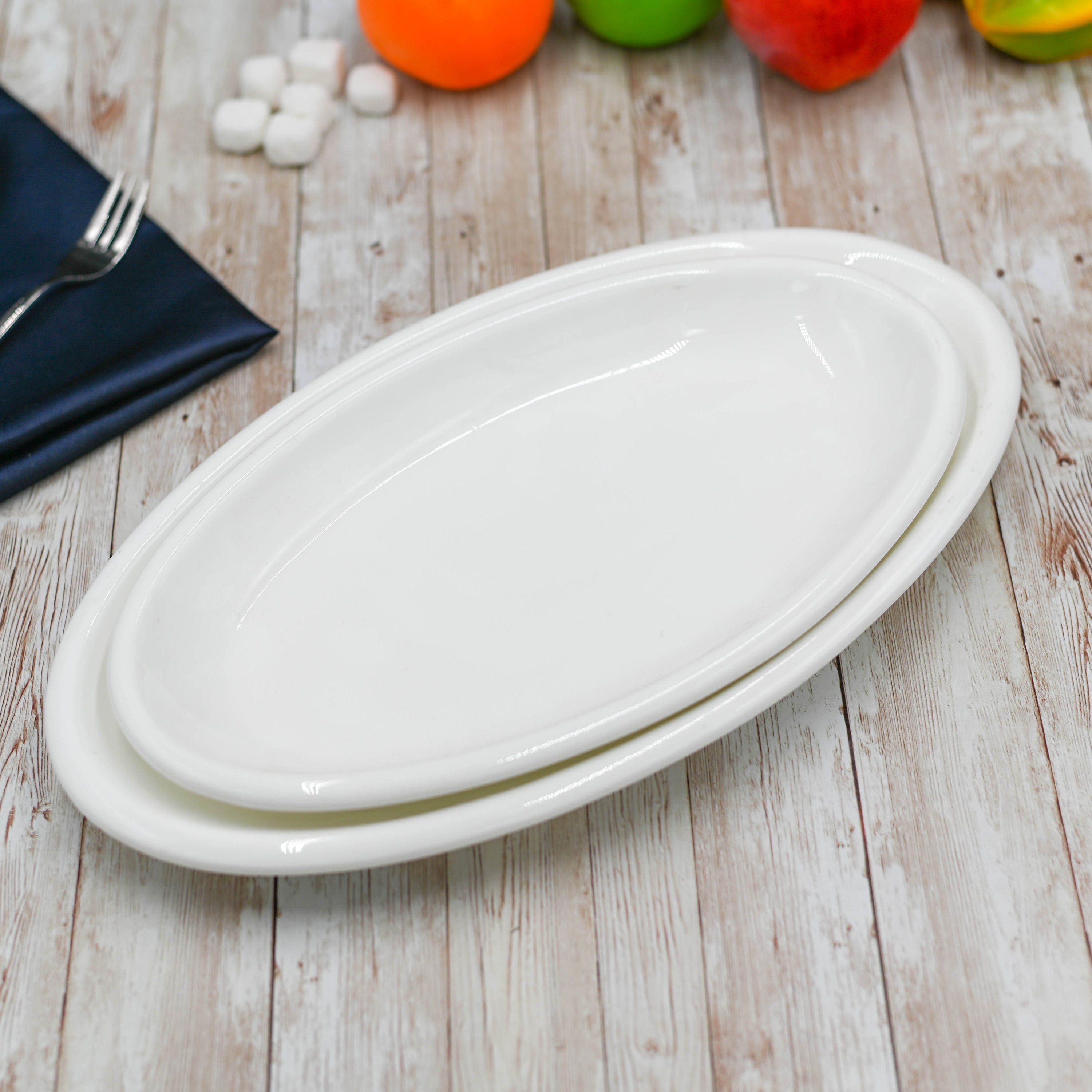 Elegant Wilmax White Oval Plate, 14.5 inches, perfect for serving various dishes.