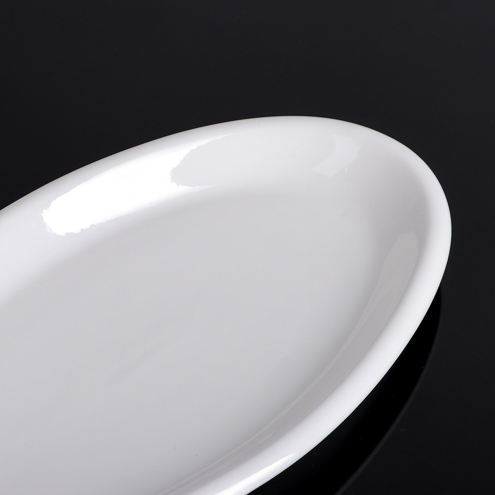 Elegant Wilmax White Oval Plate, 14.5 inches, perfect for serving various dishes.