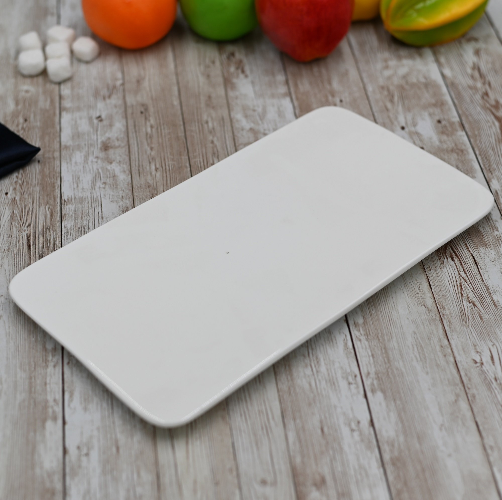 Elegant white rectangular flat platter measuring 12 inches by 6.5 inches, perfect for serving various dishes.