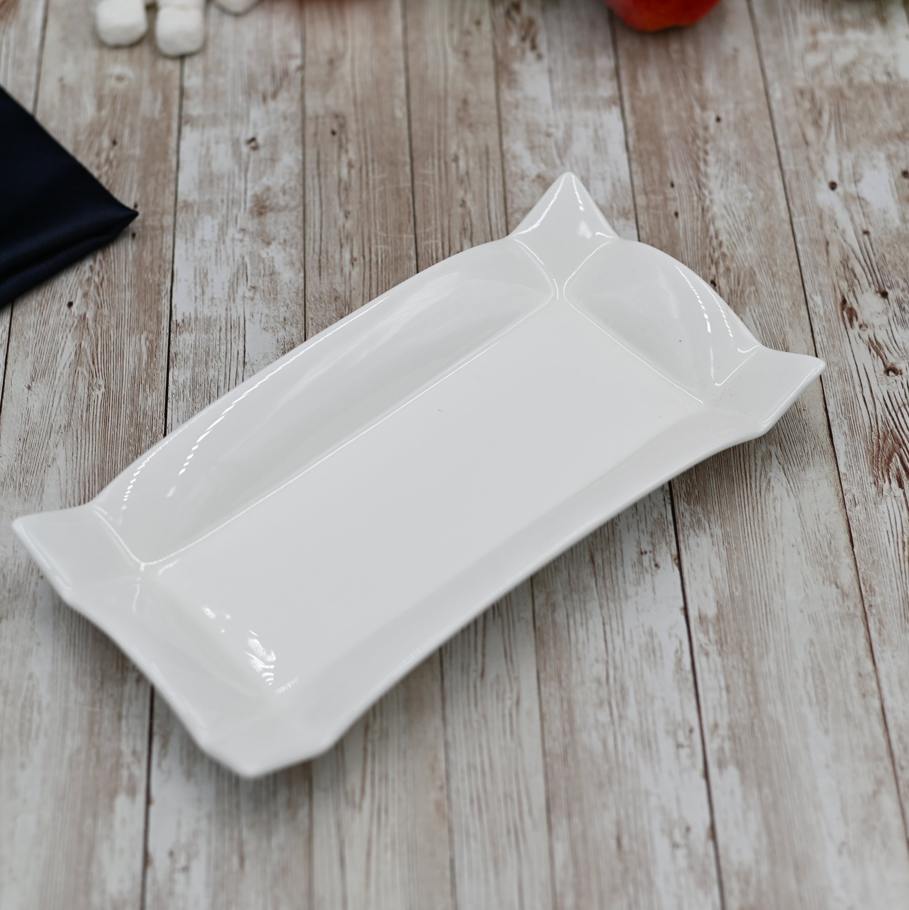 Elegant white porcelain rectangular platter measuring 10 inches by 5 inches, perfect for serving various dishes.