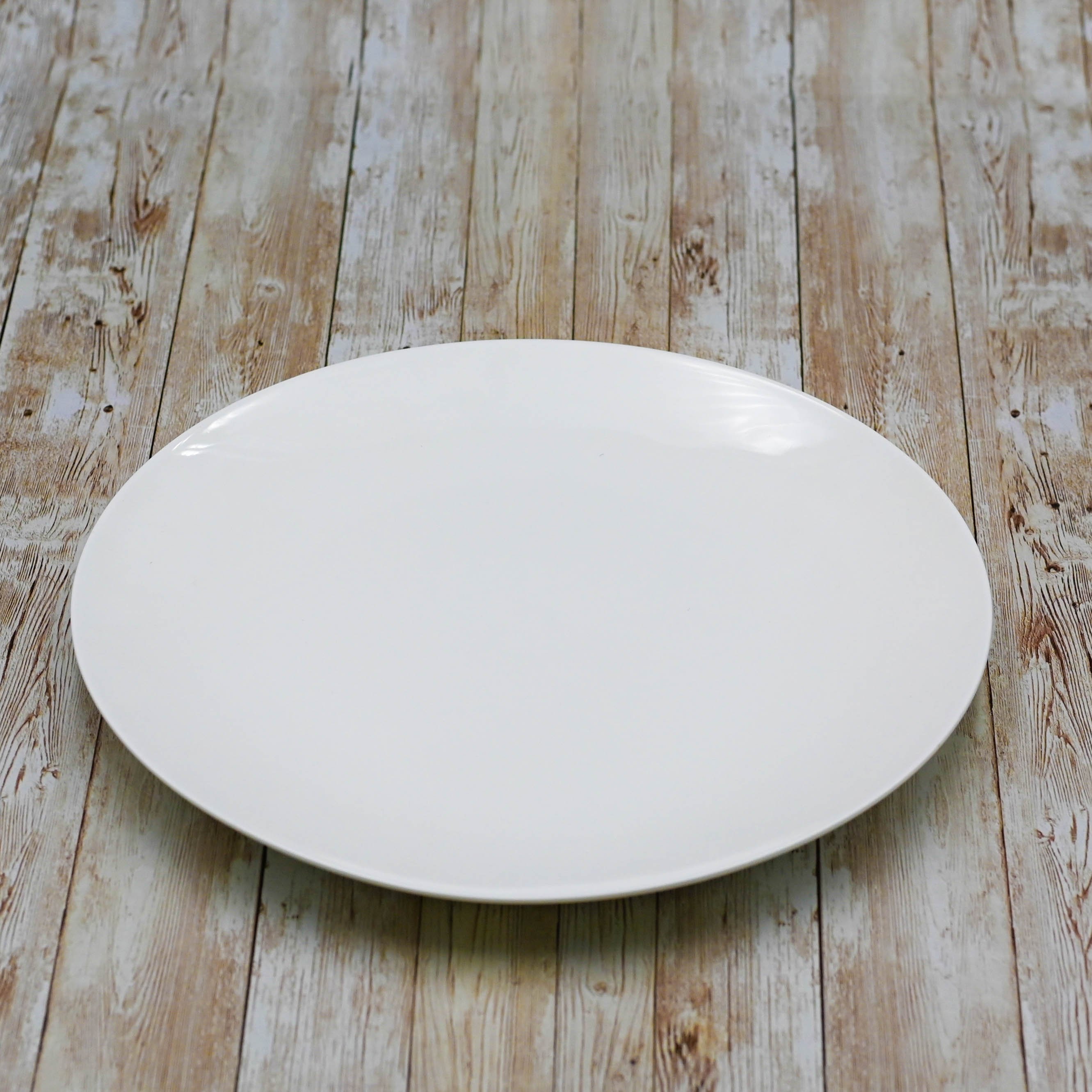 Wilmax 12-inch white round platter, elegant porcelain design for serving various dishes.