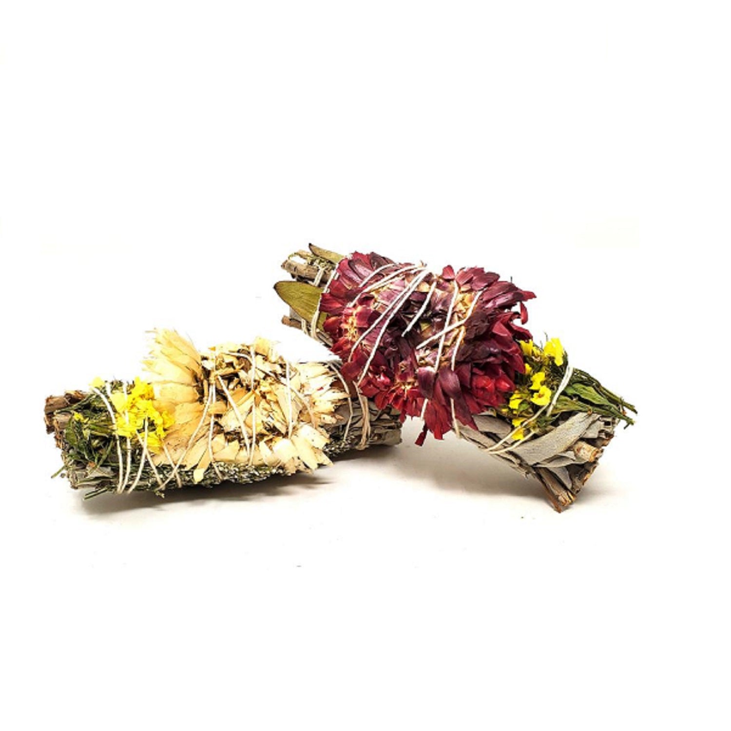 A beautifully arranged smudge stick featuring White Sage, Red Dollar Eucalyptus, Natural Cloud Flower, and Purple Sinuata, showcasing its vibrant colors and natural textures.