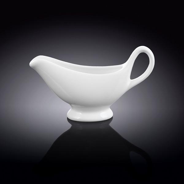 Elegant white porcelain sauce boat with handle, 6 oz capacity, perfect for serving sauces and gravies.