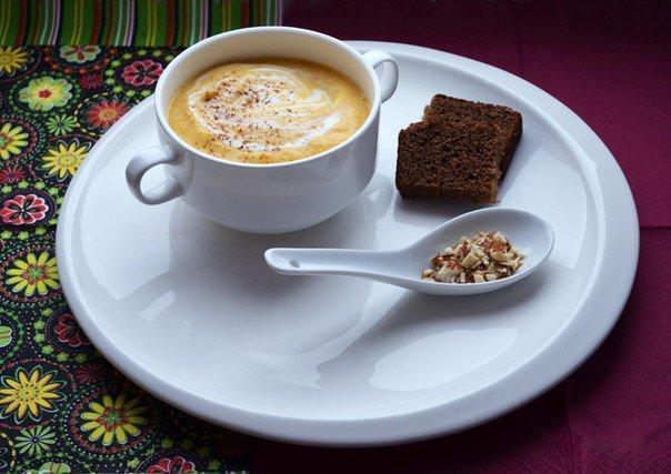 A stack of elegant white porcelain soup cups, each 4 inches in diameter, perfect for serving soups and stews.