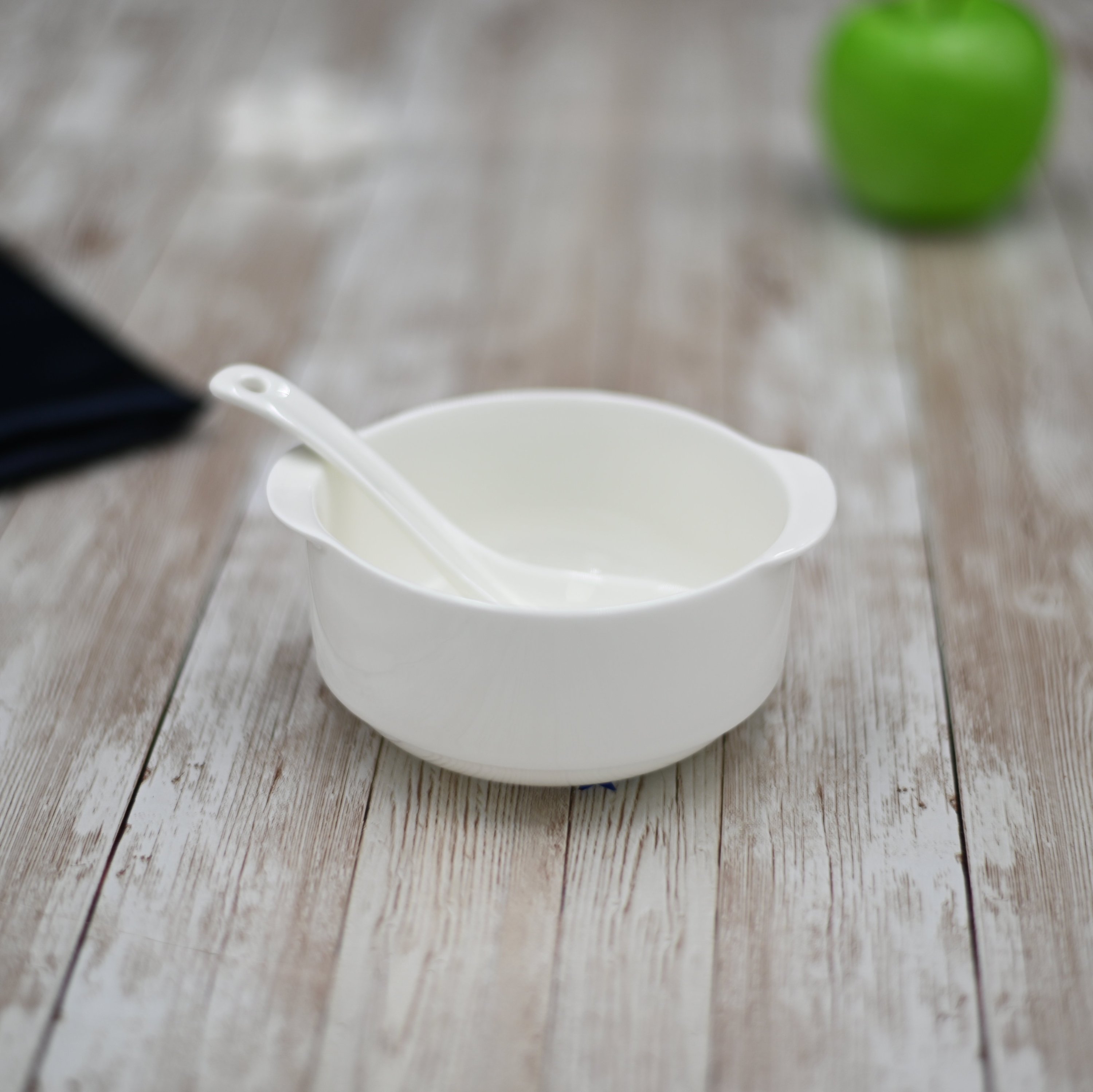 A set of elegant white porcelain soup cups, 4.25 inches in diameter, perfect for serving soups and stews.